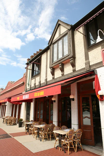 Charming restaurant exterior with outdoor seating and decorative architecture