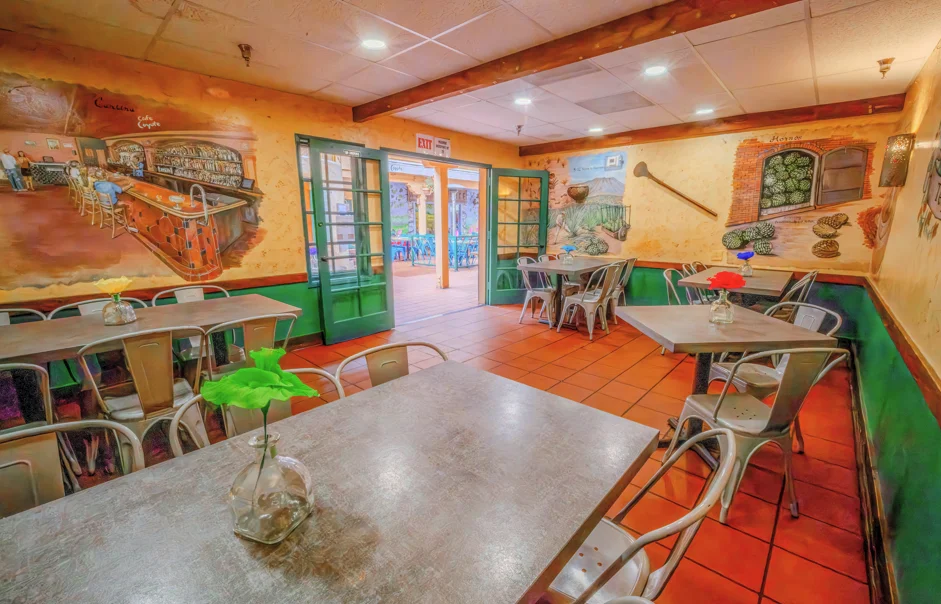Cozy restaurant interior with colorful murals and tables
