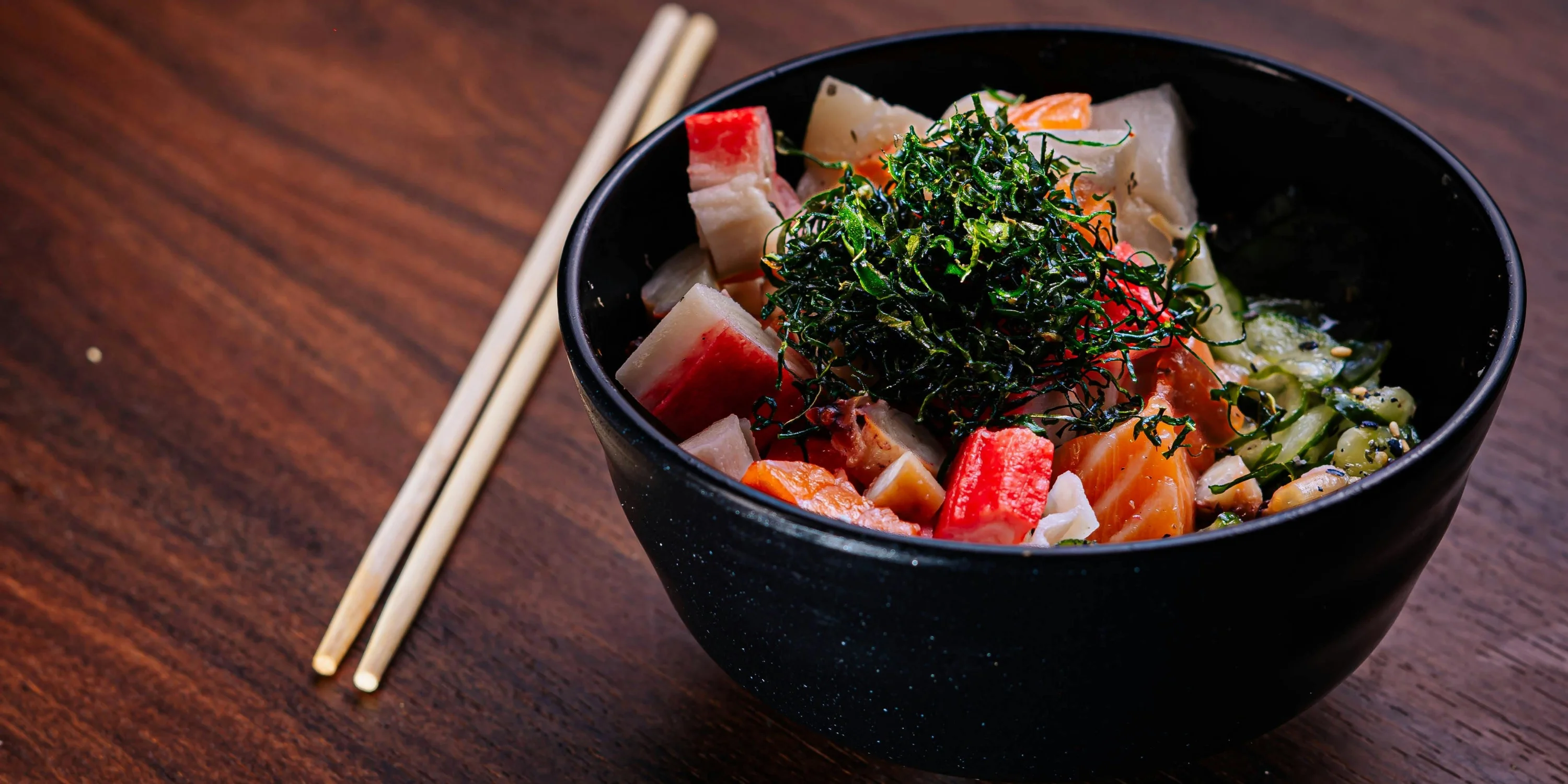 sushi poke bowl with chopsticks