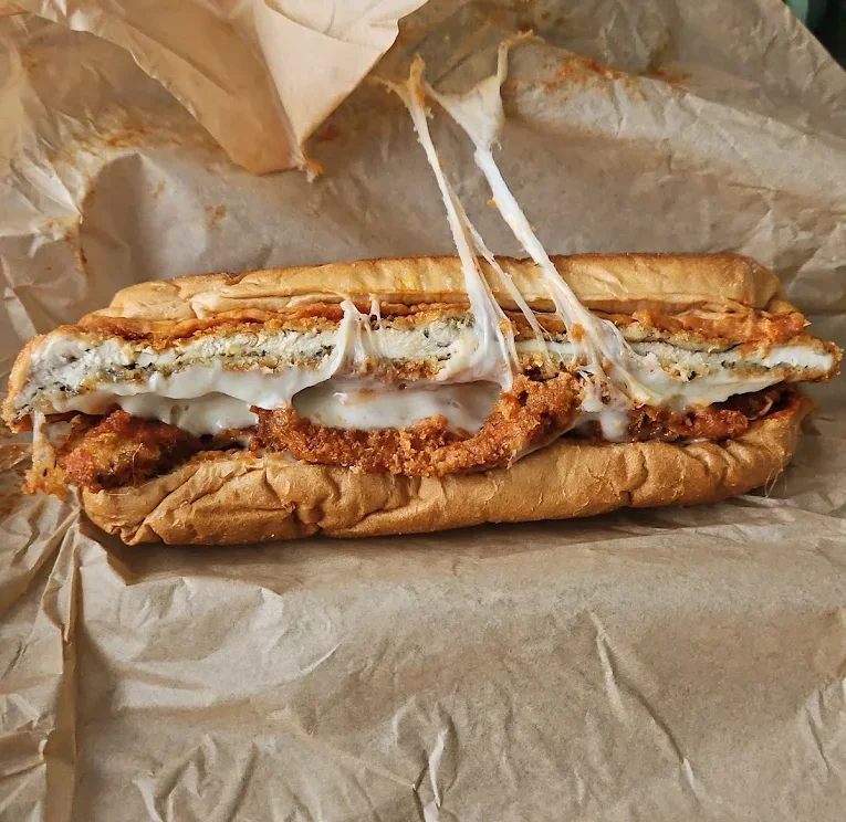 Italian-American chicken Parmesan sandwich with marinara and melted mozzarella