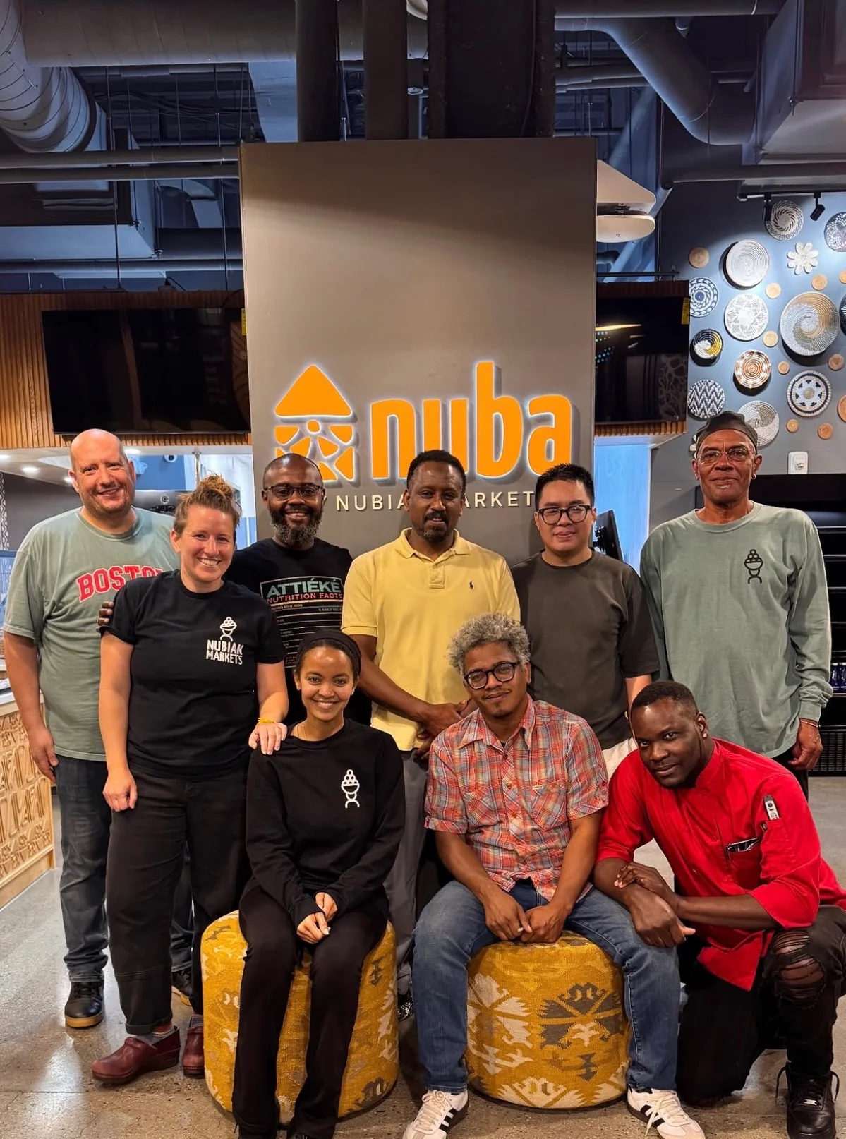 Team photo at Nuba Market showcasing diverse culinary culture