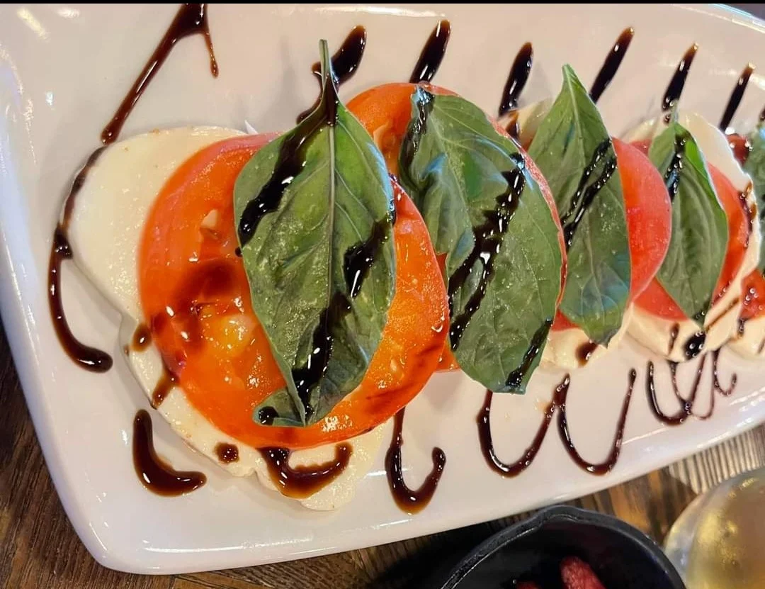 Caprese salad with fresh basil and balsamic drizzle