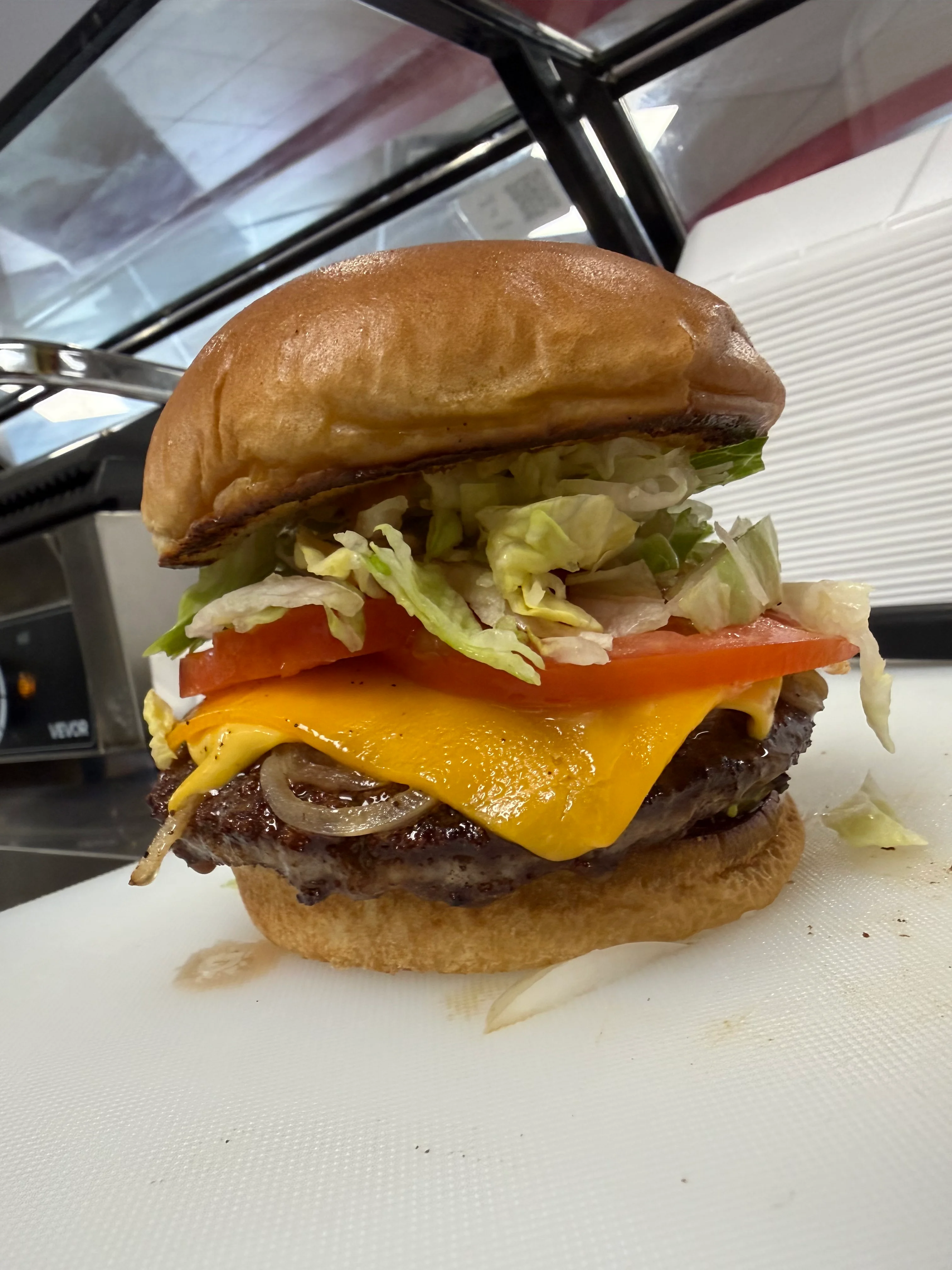 Juicy cheeseburger with fresh toppings