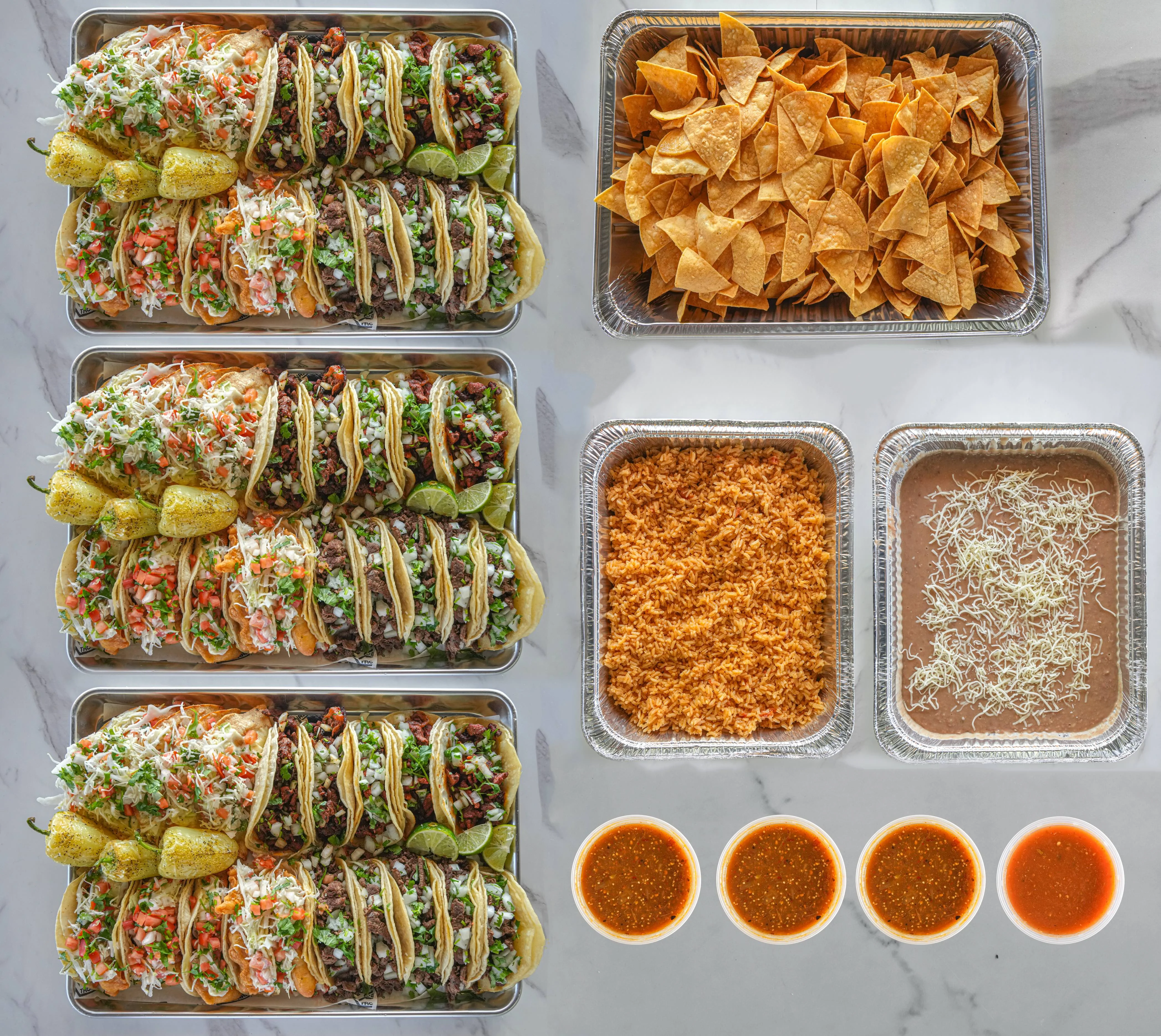 3 trays of 20 assorted tacos with rice, beans, salsa & chips
