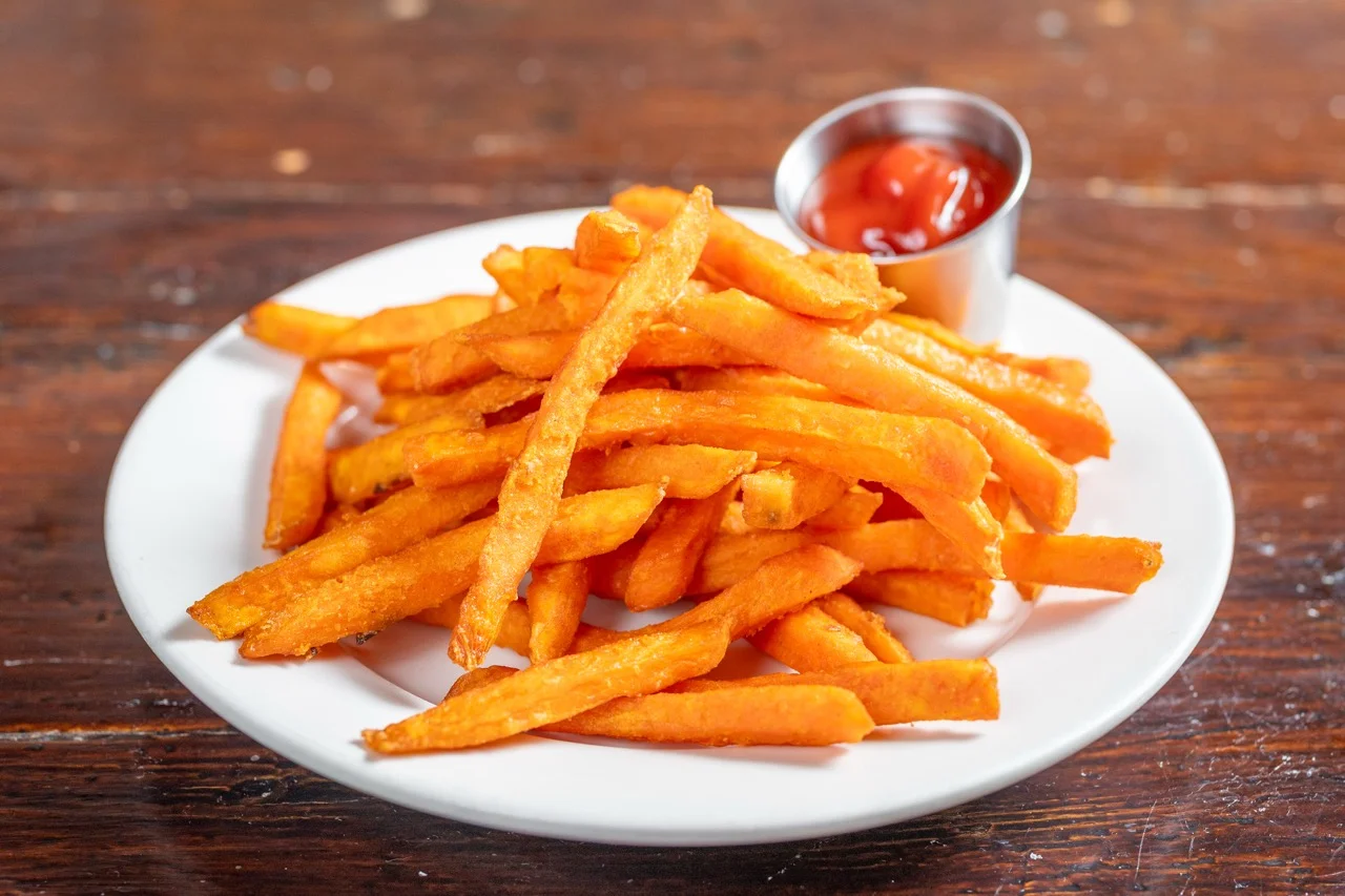 Crispy sweet potato fries served with ketchup