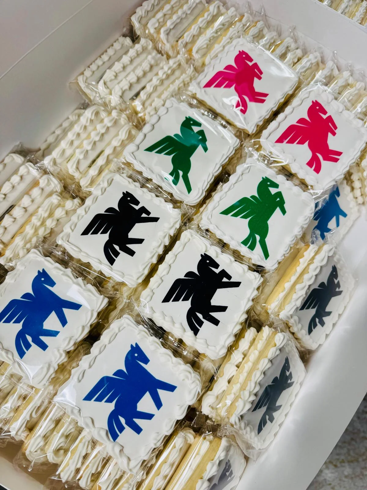 Decorative cookies featuring colorful winged horse designs