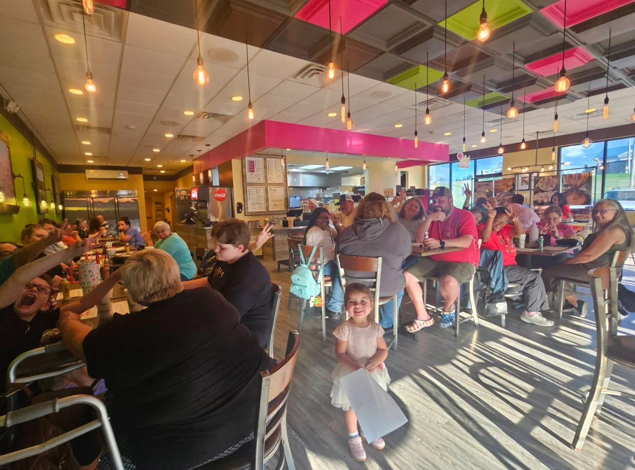 Lively restaurant interior with families enjoying meals