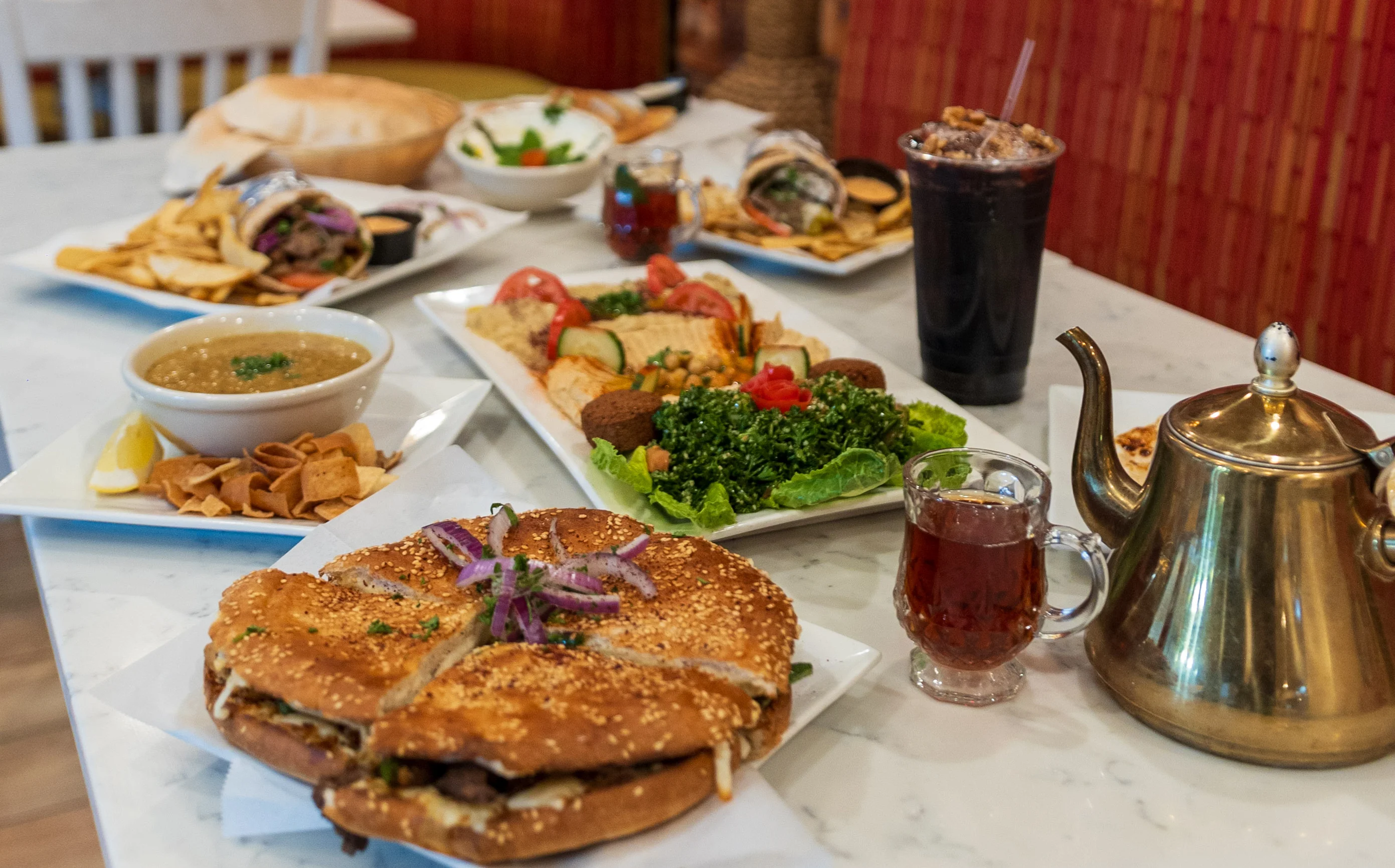 Middle Eastern feast with shawarma, falafel, and tea