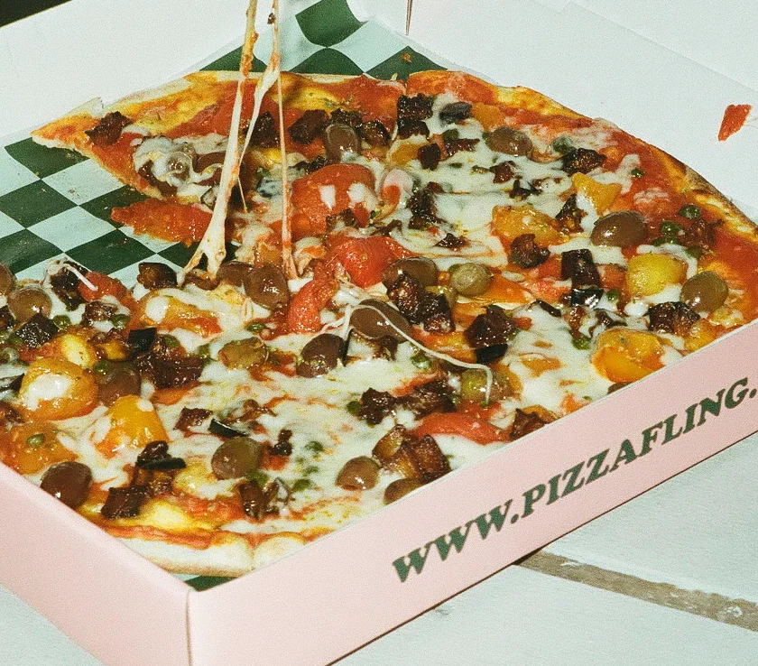 Delicious pepperoni pizza in a takeout box