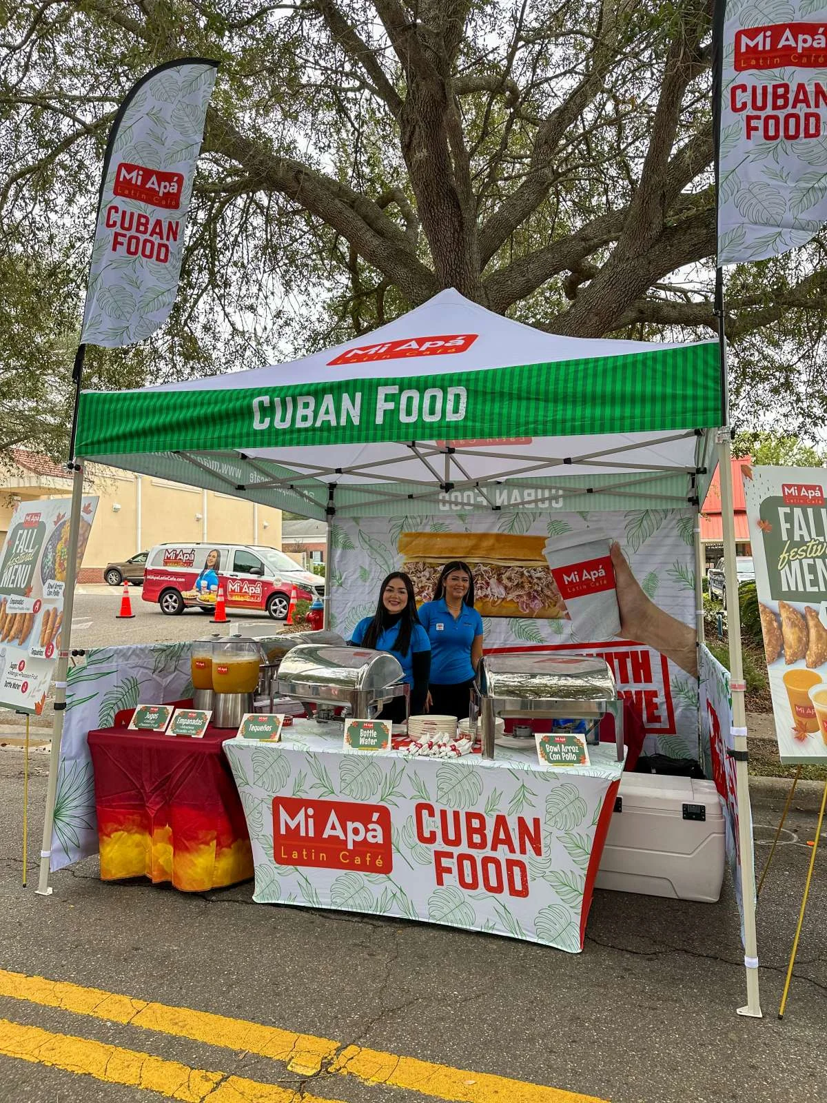 Cuban food stall featuring traditional dishes at a festival