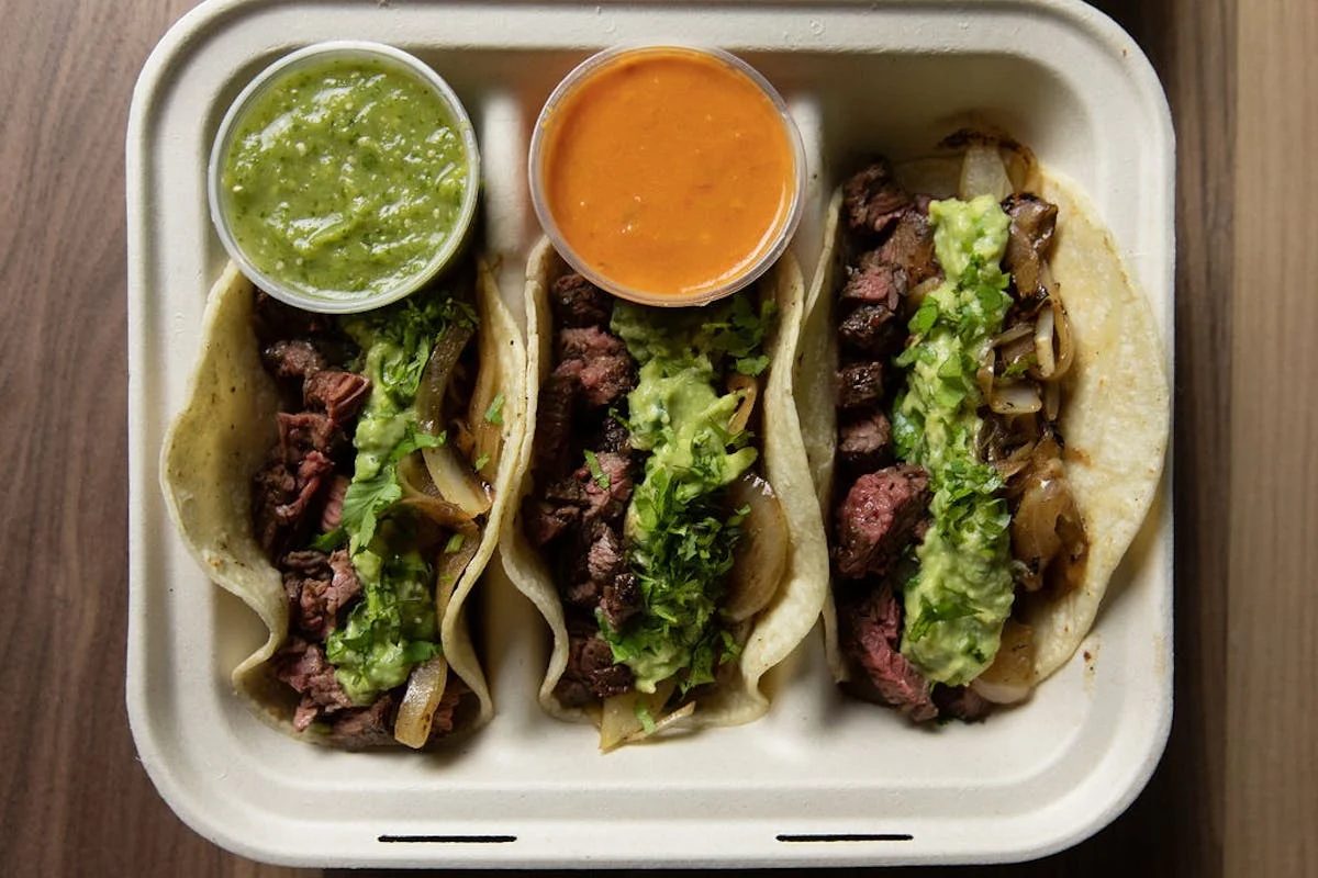 Authentic Mexican tacos with grilled steak and salsas