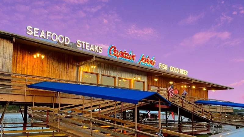 Cozy seafood restaurant with wooden deck and sunset sky