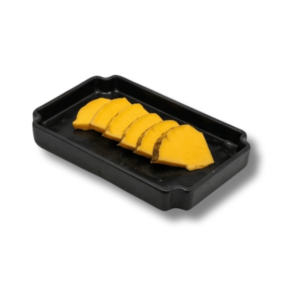 Sliced yellow cheese on a black serving tray.