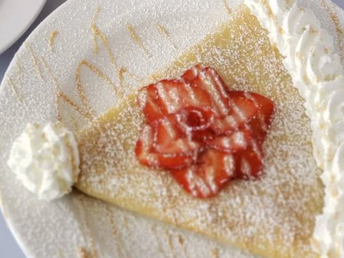 Crepes topped with strawberries
