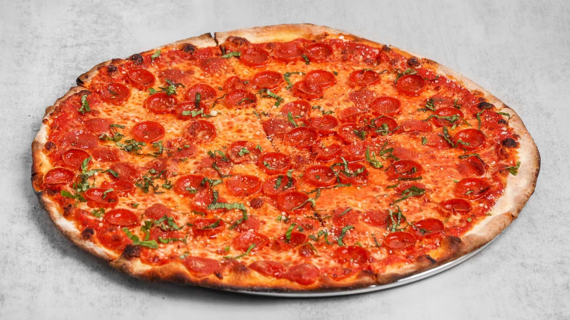 Classic pepperoni pizza with fresh basil
