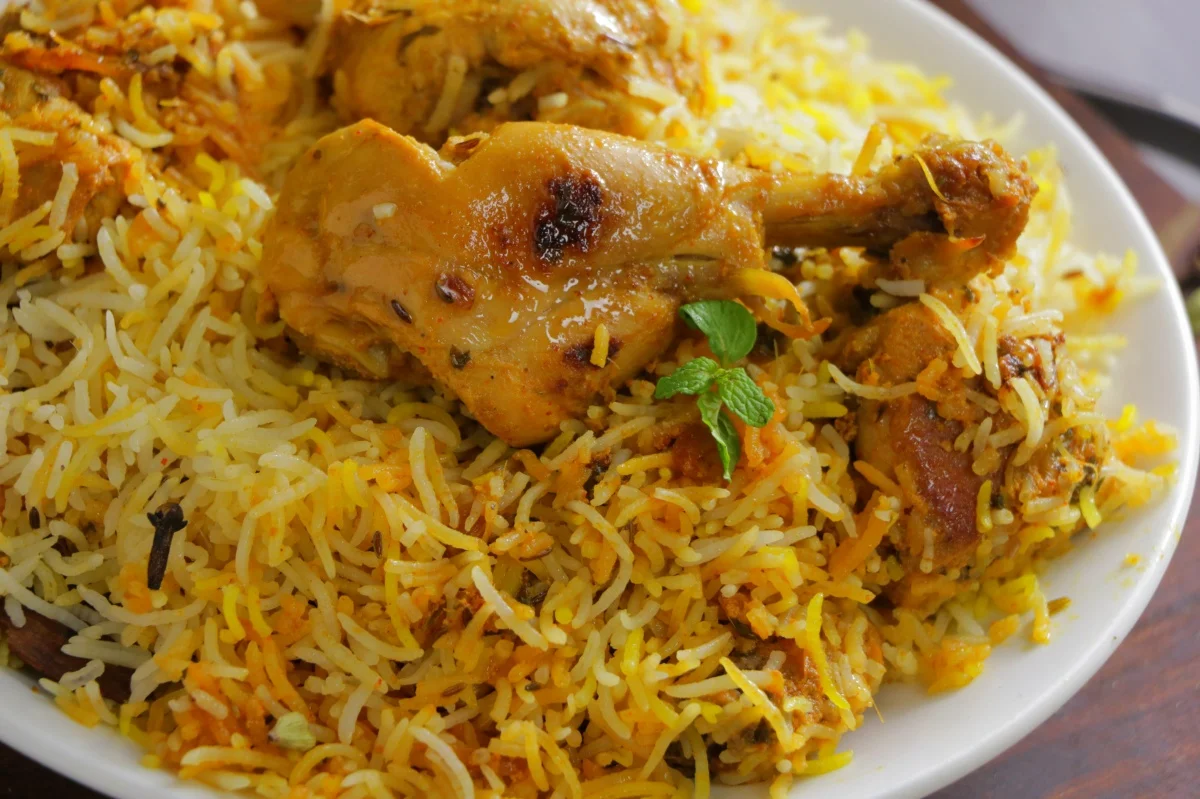Delicious chicken biryani served on a white plate