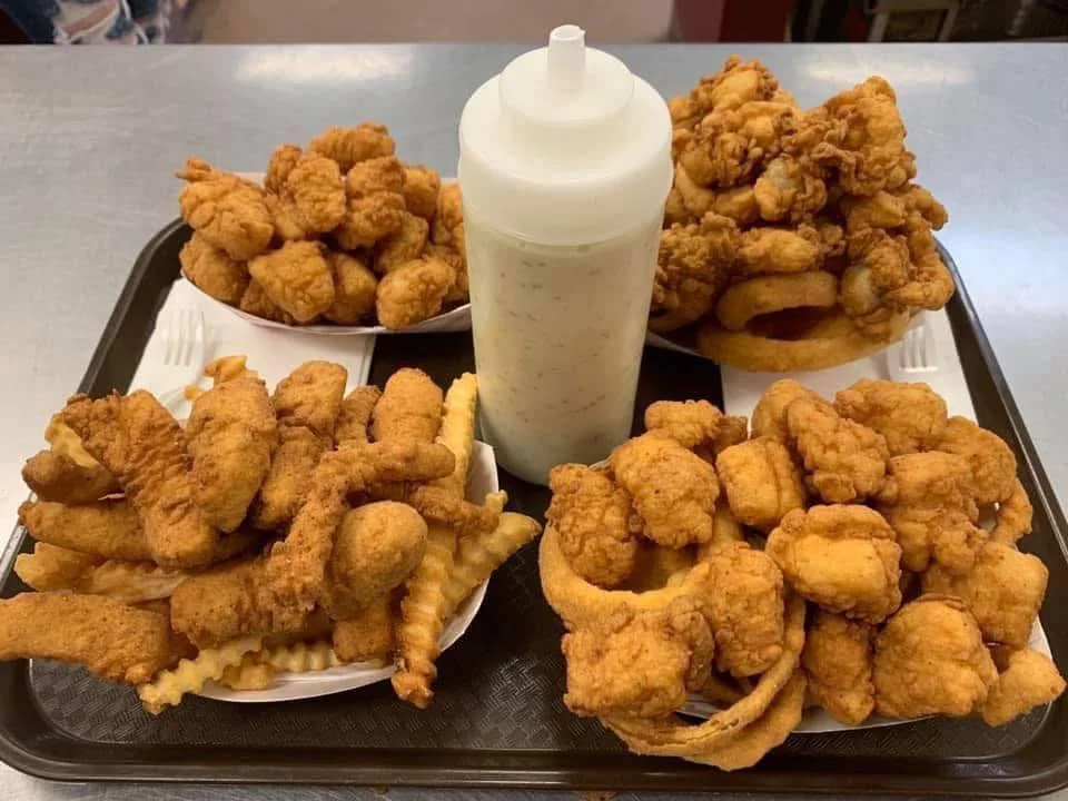 Southern fried seafood platter with hushpuppies and dipping sauce