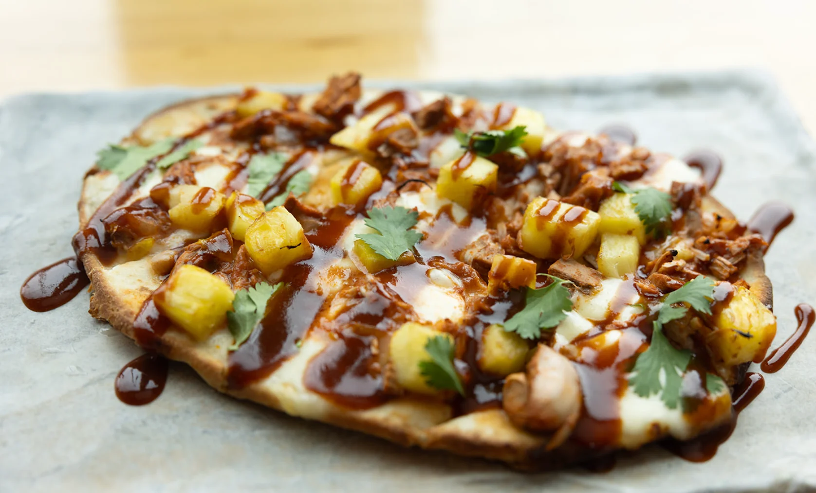 Hawaiian BBQ chicken flatbread with pineapple and cilantro