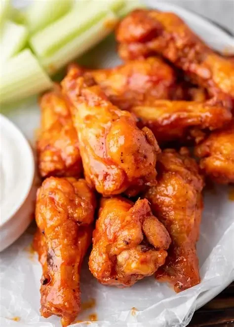 Crispy buffalo chicken wings served with celery and ranch dressing