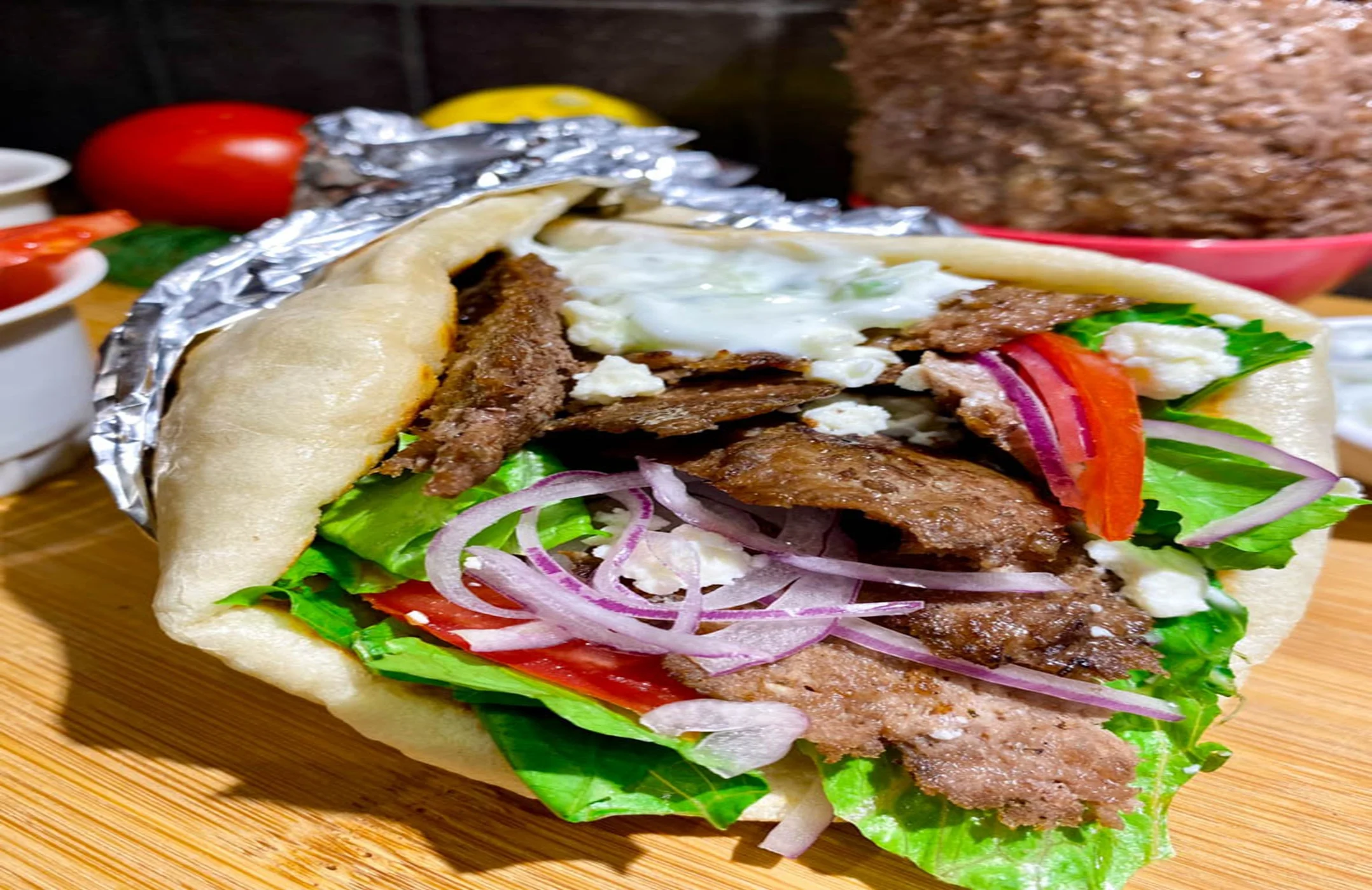 Delicious gyro wrap with grilled meat and fresh vegetables