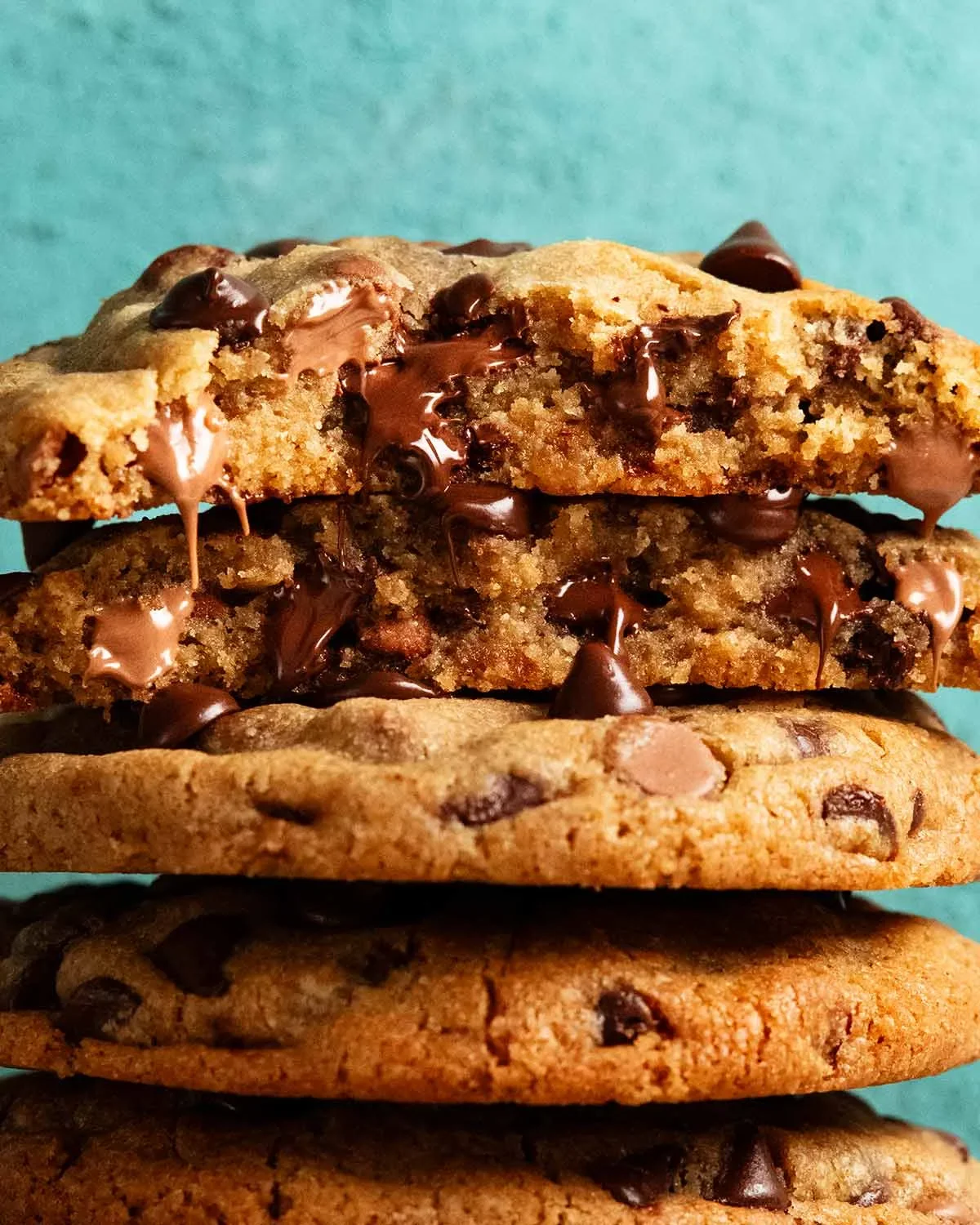 Freshly baked chocolate chip cookies stacked high