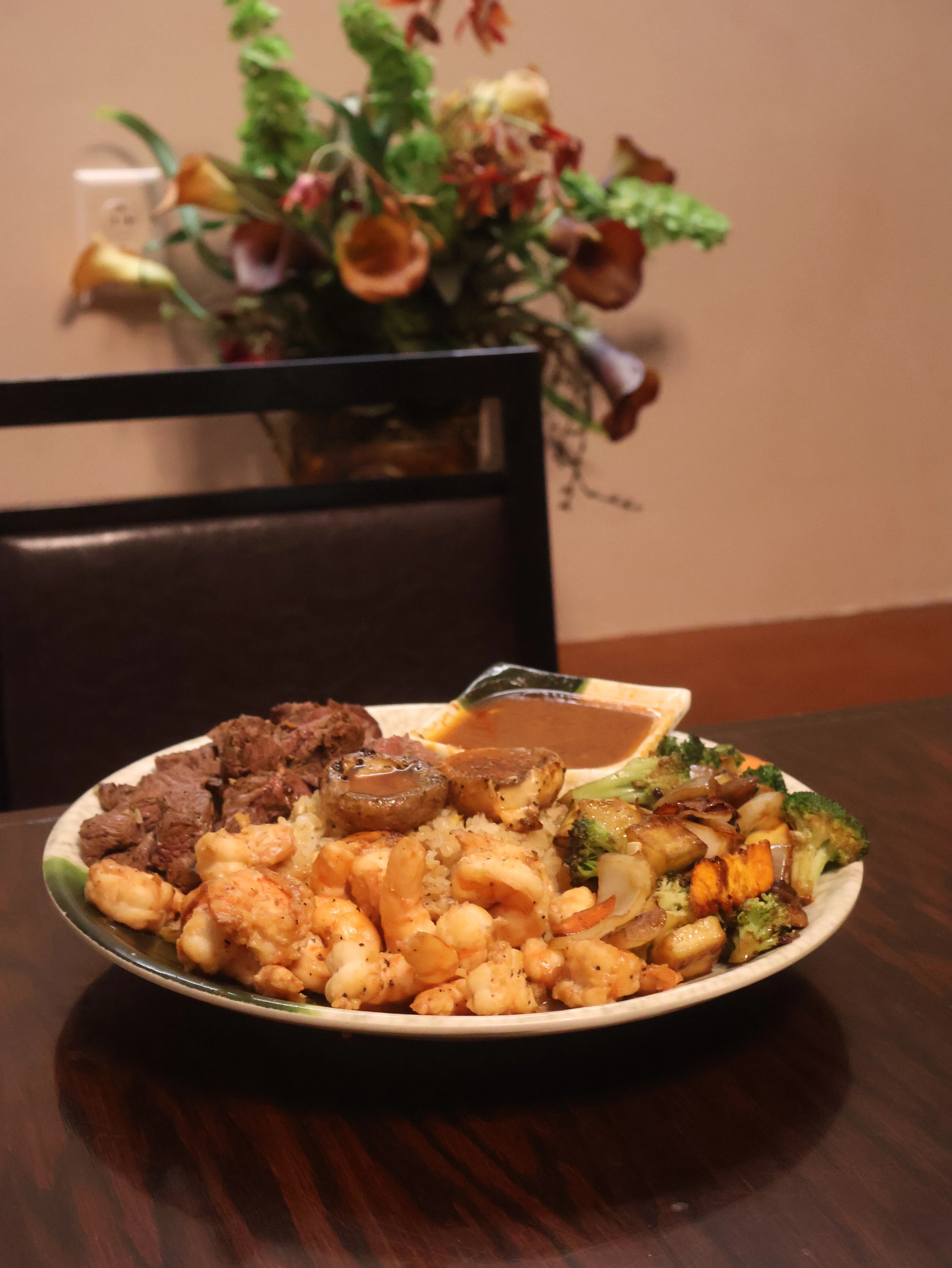 Mixed seafood and beef platter with rice and vegetables