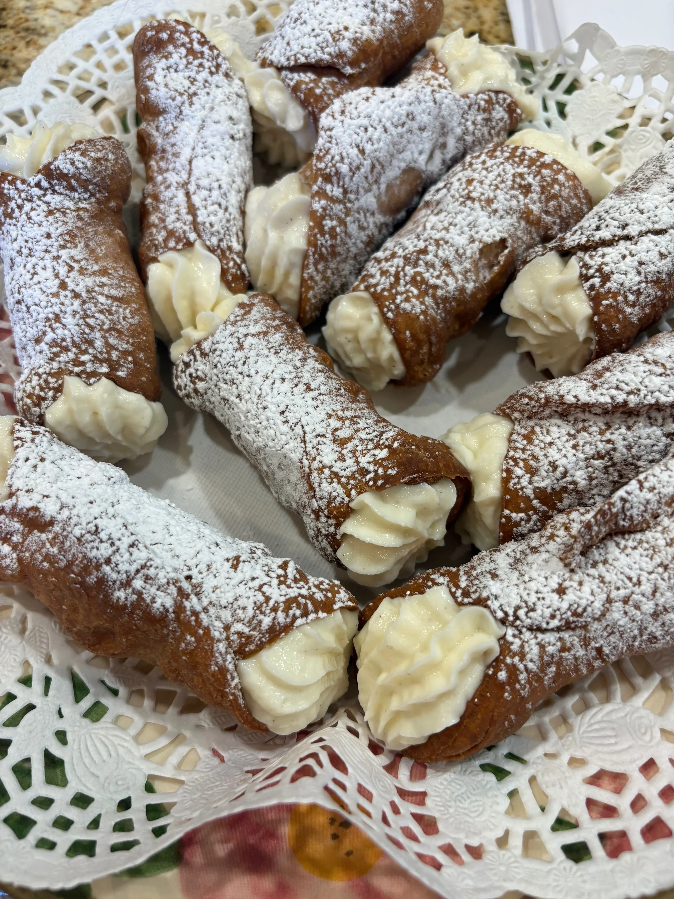 Delicious Italian cannoli dusted with powdered sugar