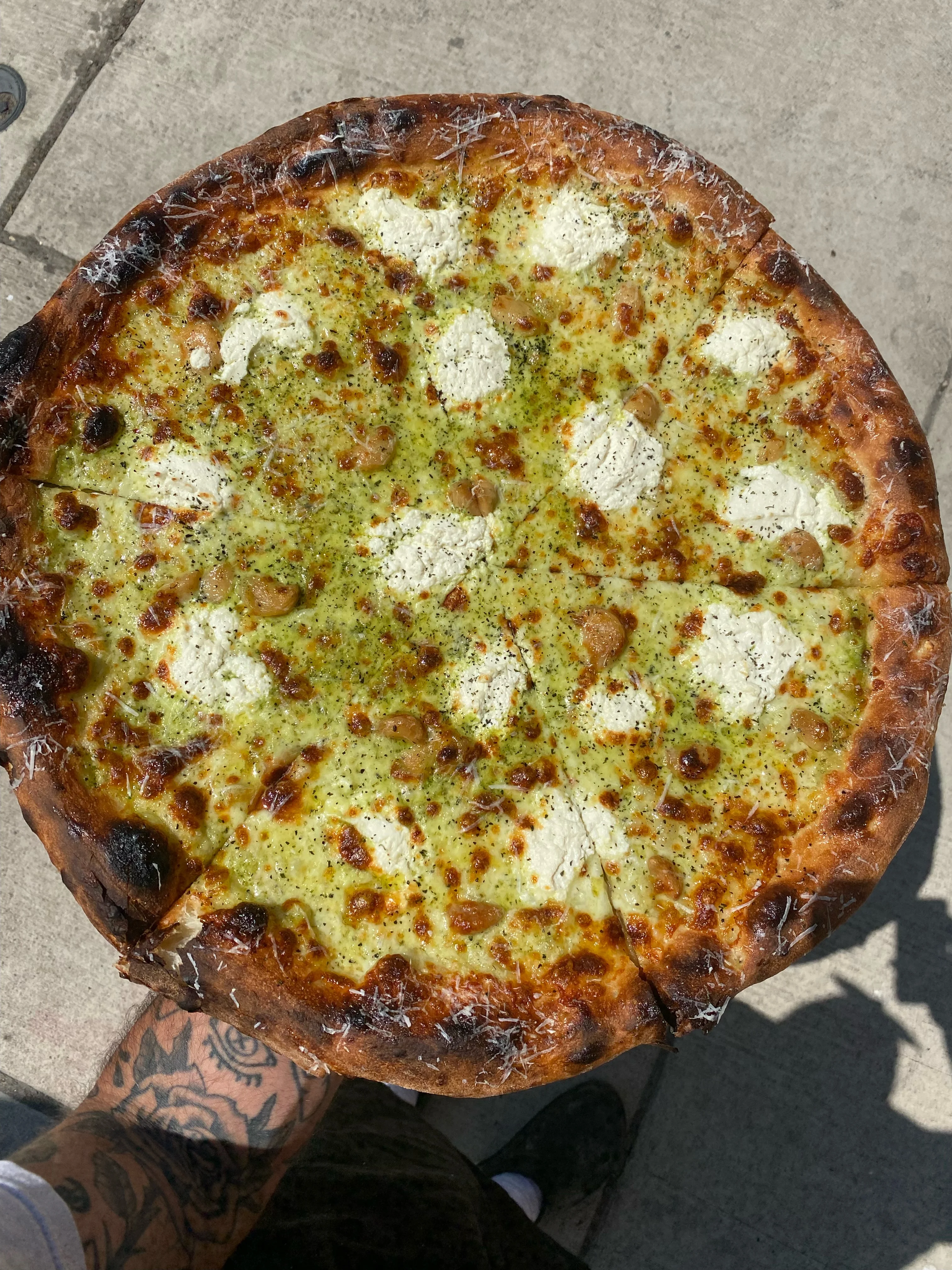 Pesto pizza with ricotta and crispy crust