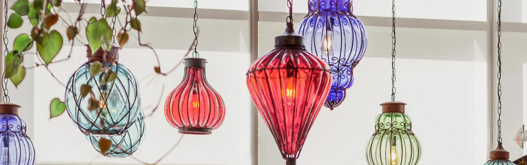 Colorful hanging glass lanterns in a cozy restaurant setting