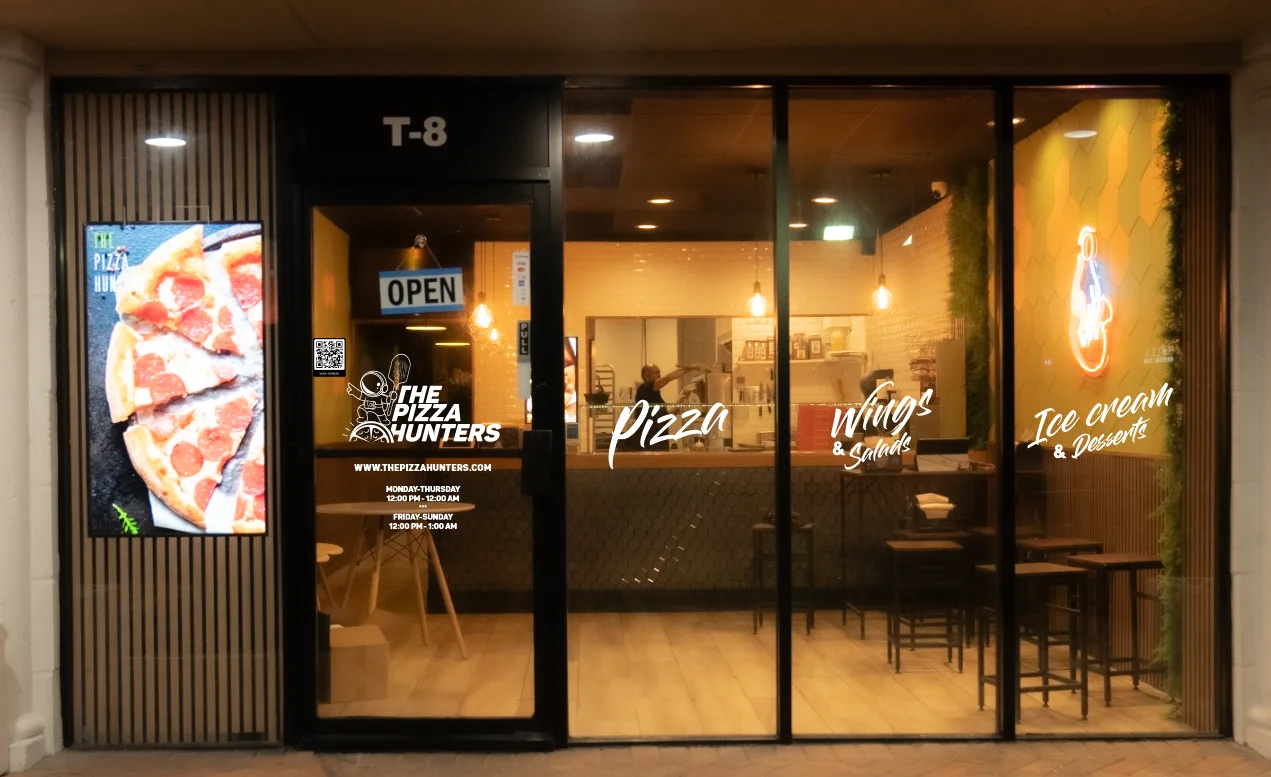 Modern pizza restaurant exterior with open sign