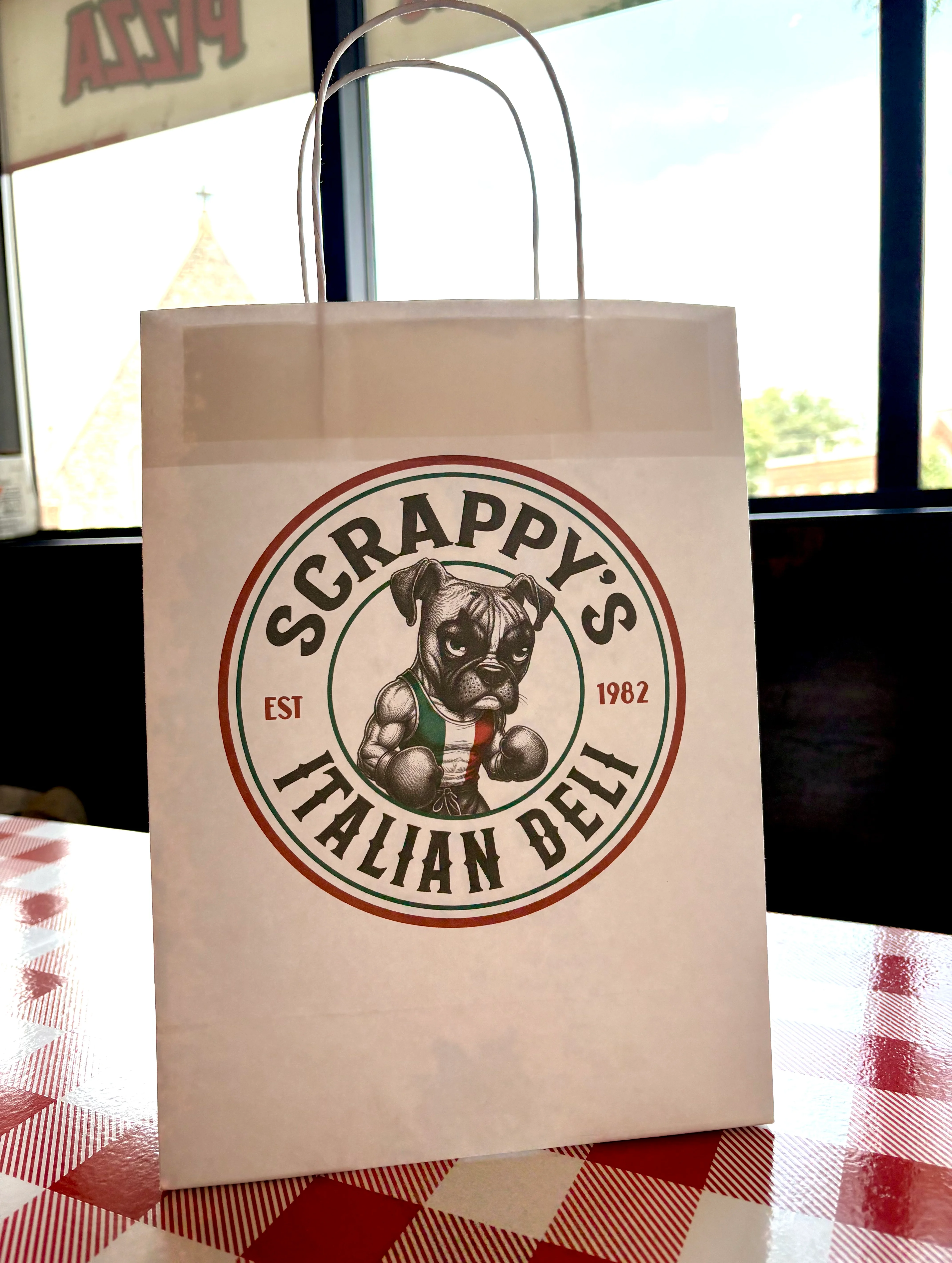 Branded takeout bag from Scrappy's Italian Deli