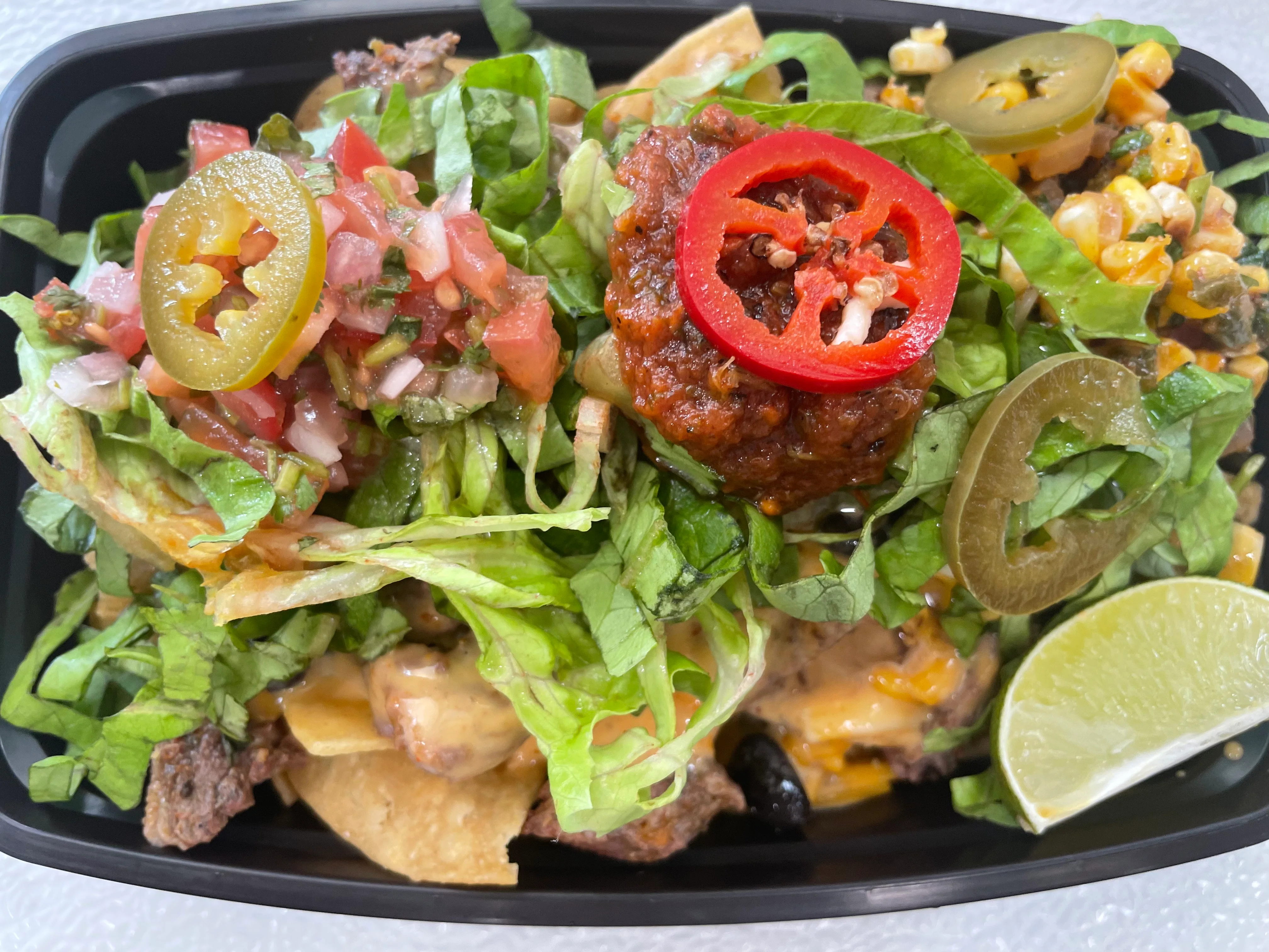 Loaded nachos with fresh toppings and salsa
