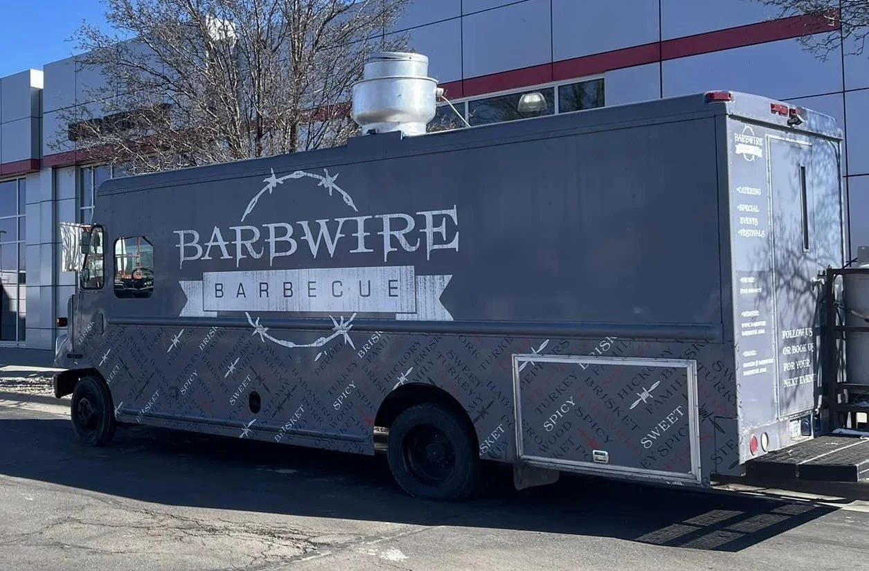 Food truck serving barbecue cuisine with a rustic design