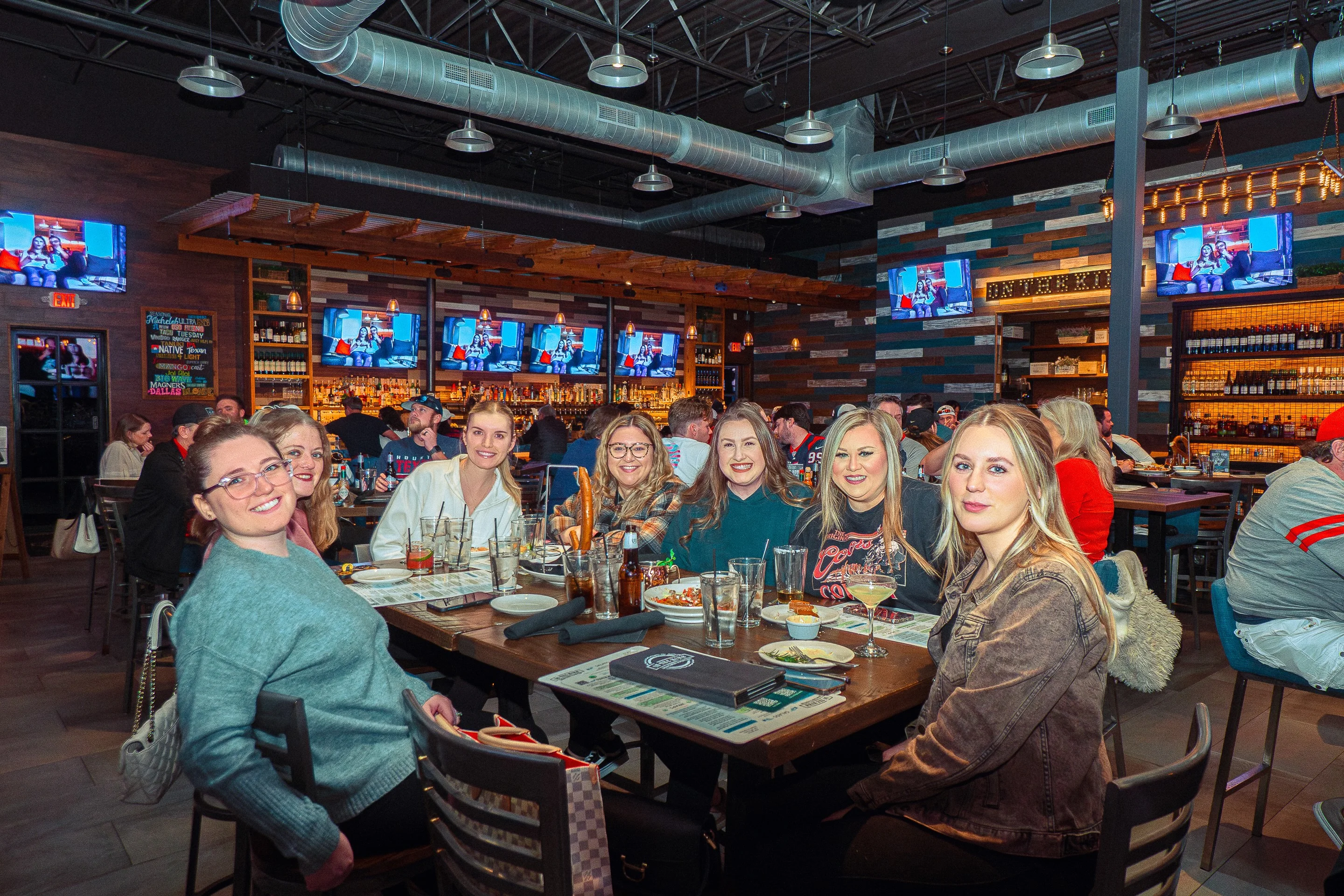 Lively restaurant interior with friends enjoying a meal together