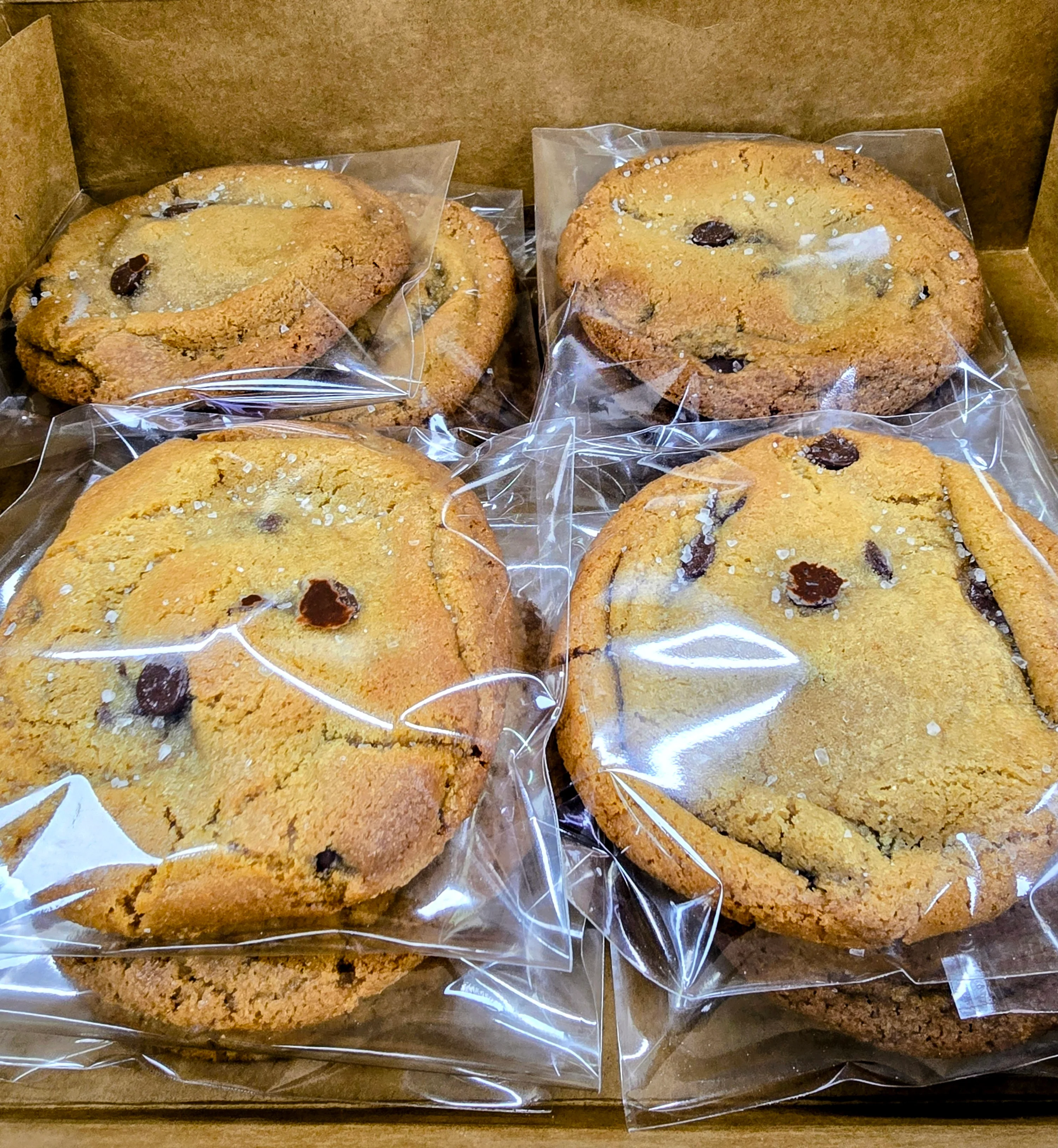 Freshly baked chocolate chip cookies in a box