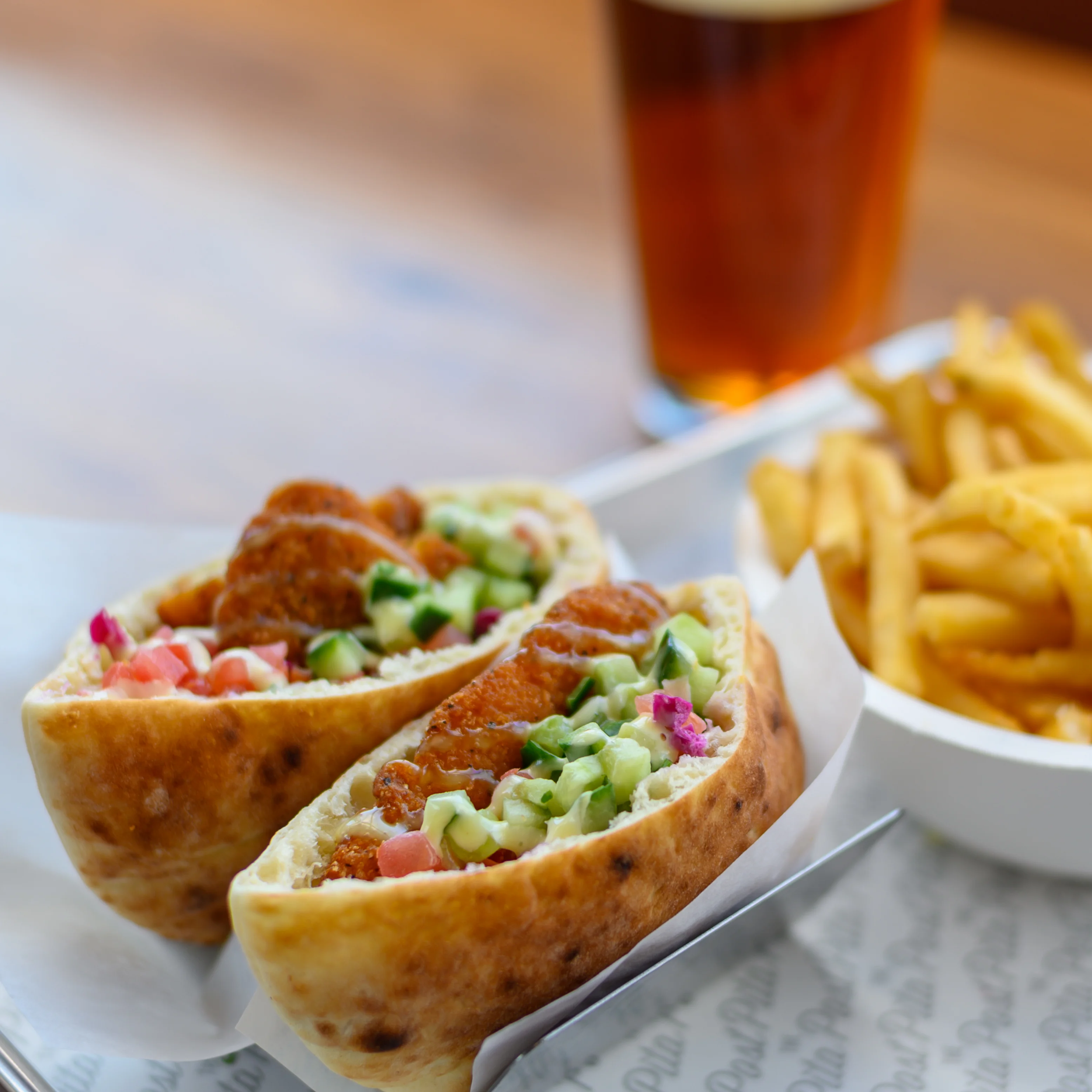 Crispy chicken stuffed in pita bread with an assortment of veggies