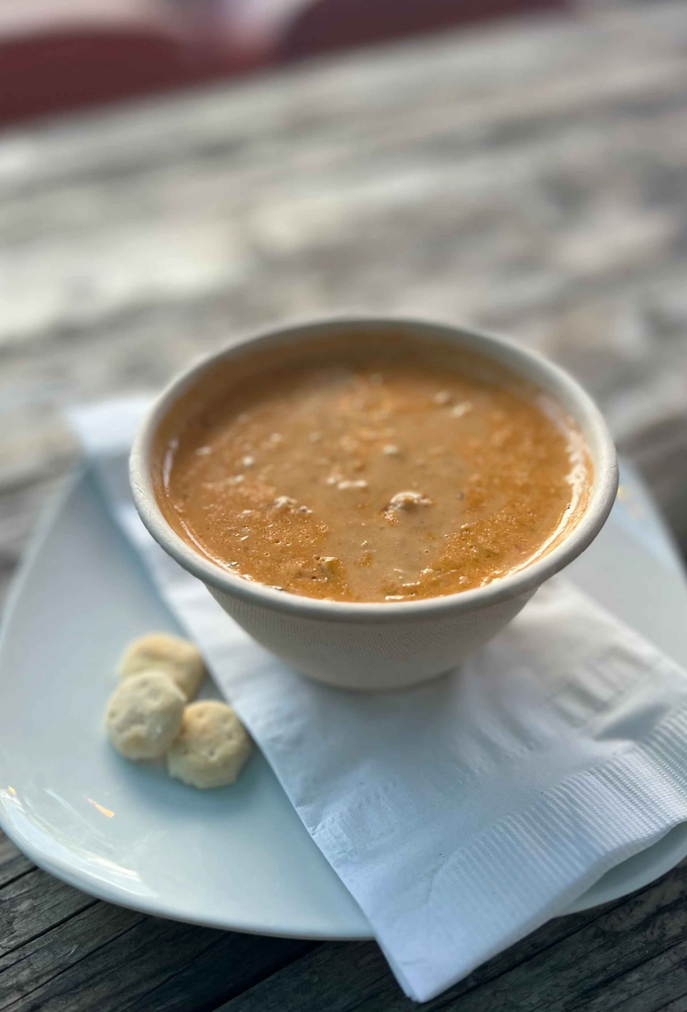 Bowl of creamy New England clam chowder with crackers