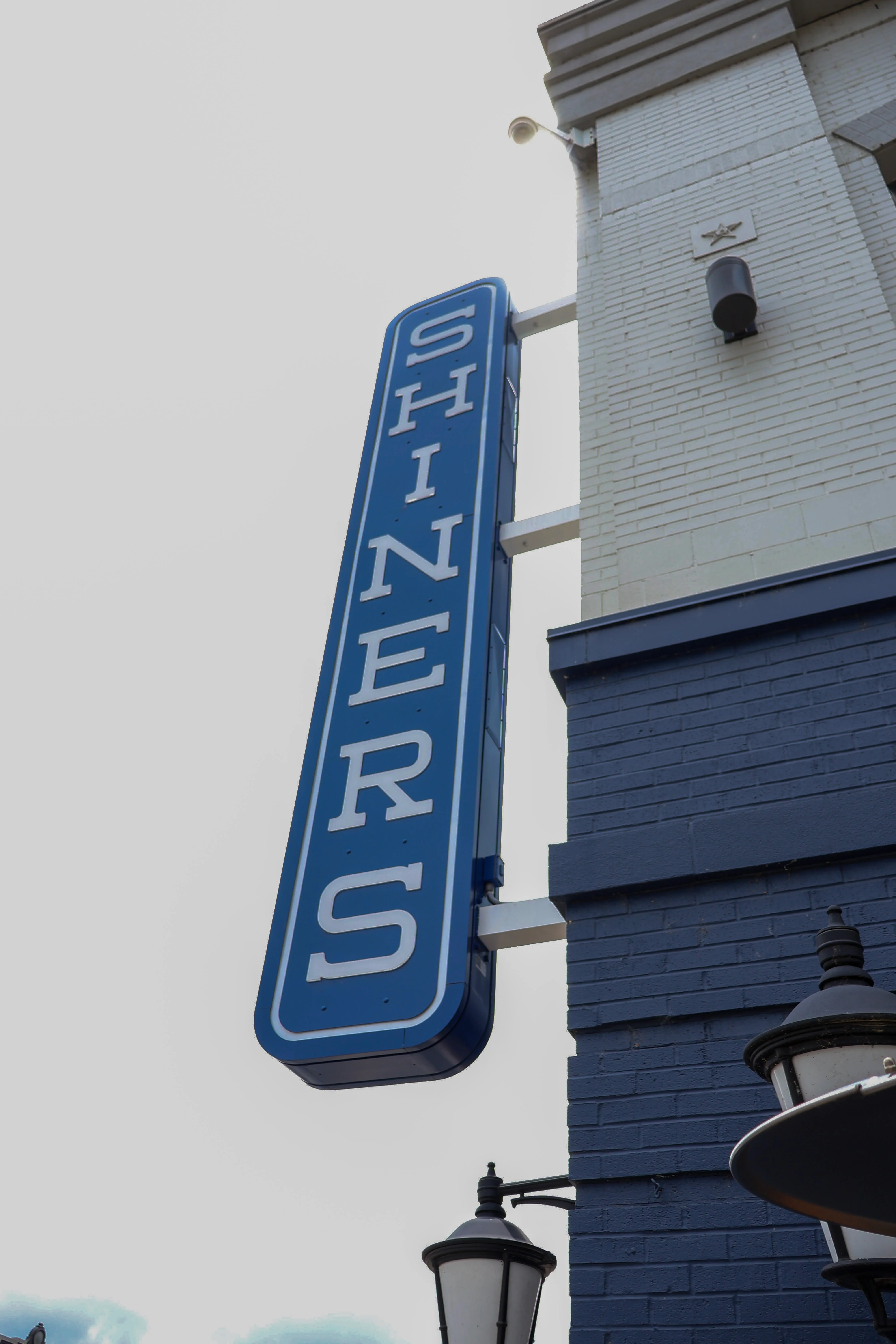 Signage for Shiners restaurant in blue and white