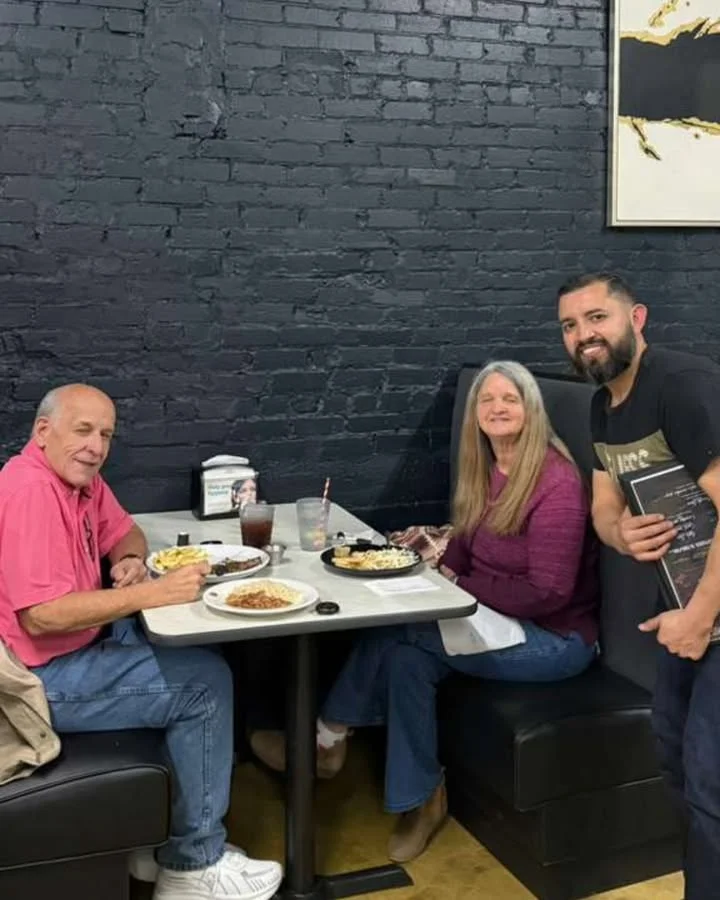 Cozy restaurant scene with diners enjoying plates of comfort food