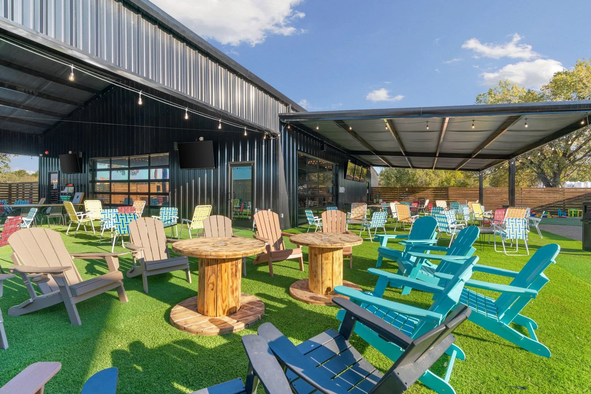Outdoor dining area with colorful chairs and tables