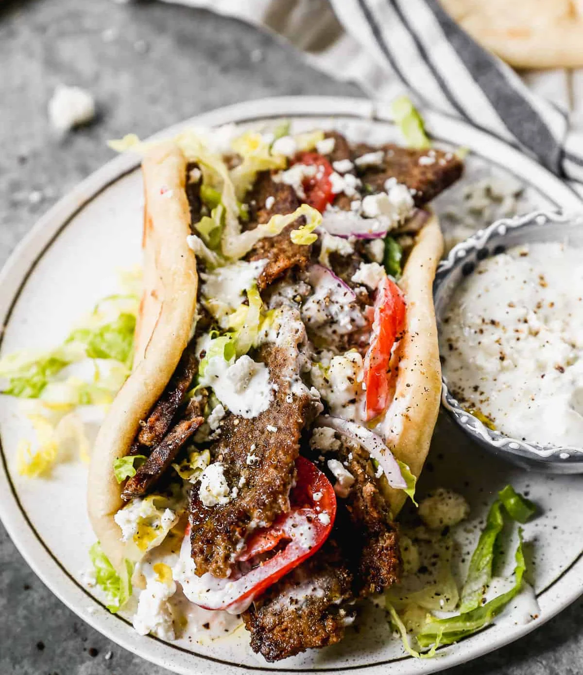 Delicious Greek gyro with meat, lettuce, and tomatoes