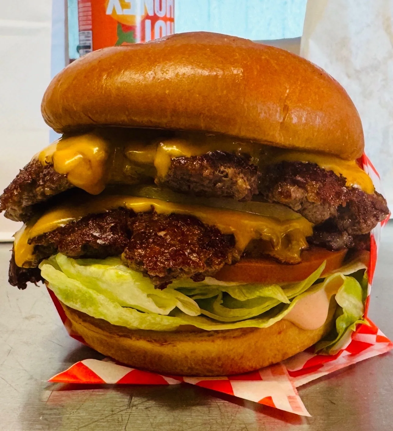 Double cheeseburger with lettuce and pickles