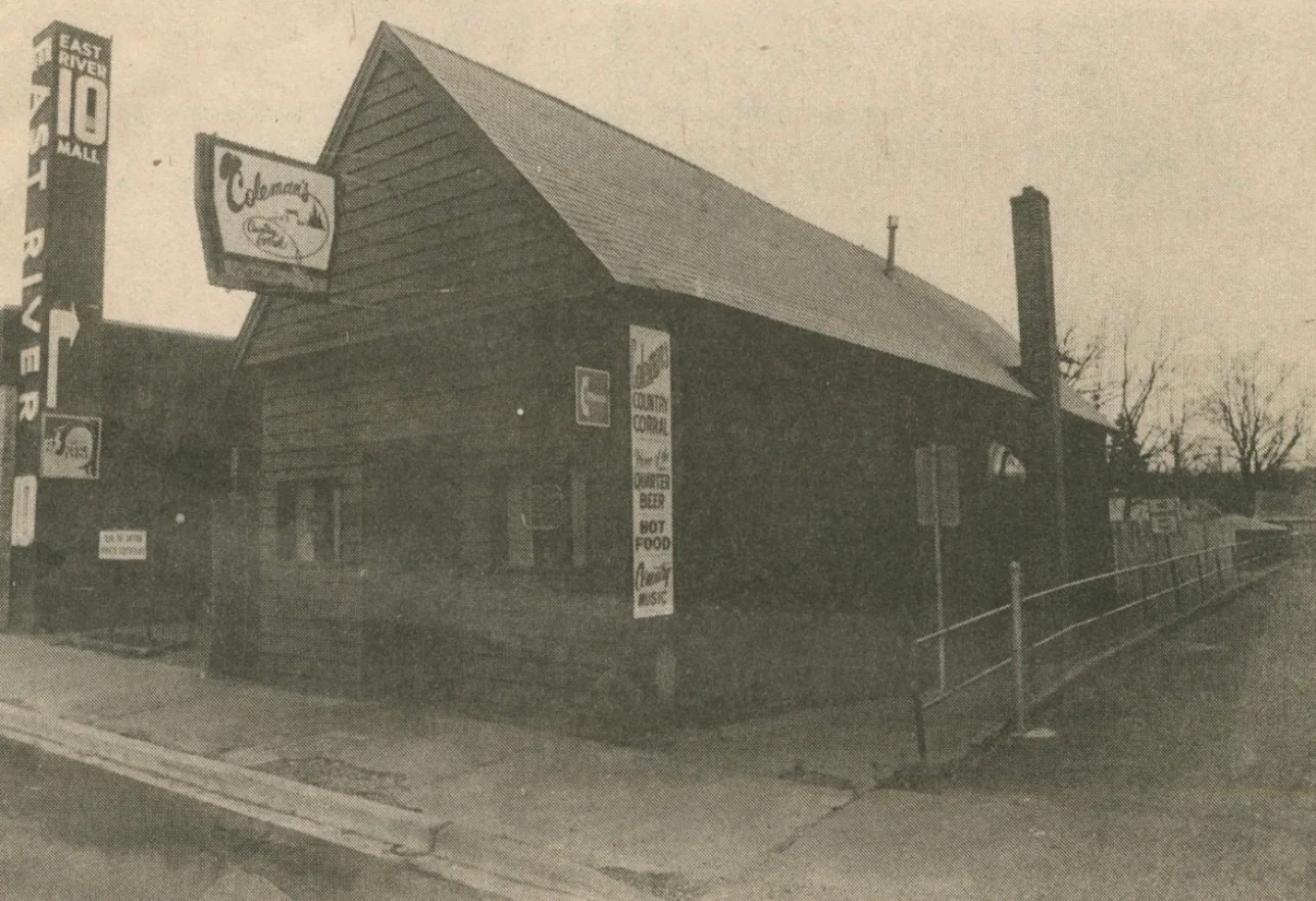 Exterior view of a rustic restaurant with signage and a wooden facade