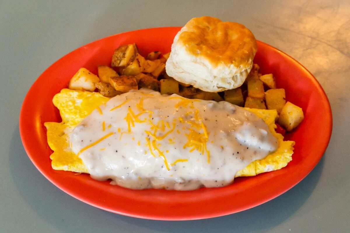Southern-style breakfast plate with biscuits and gravy