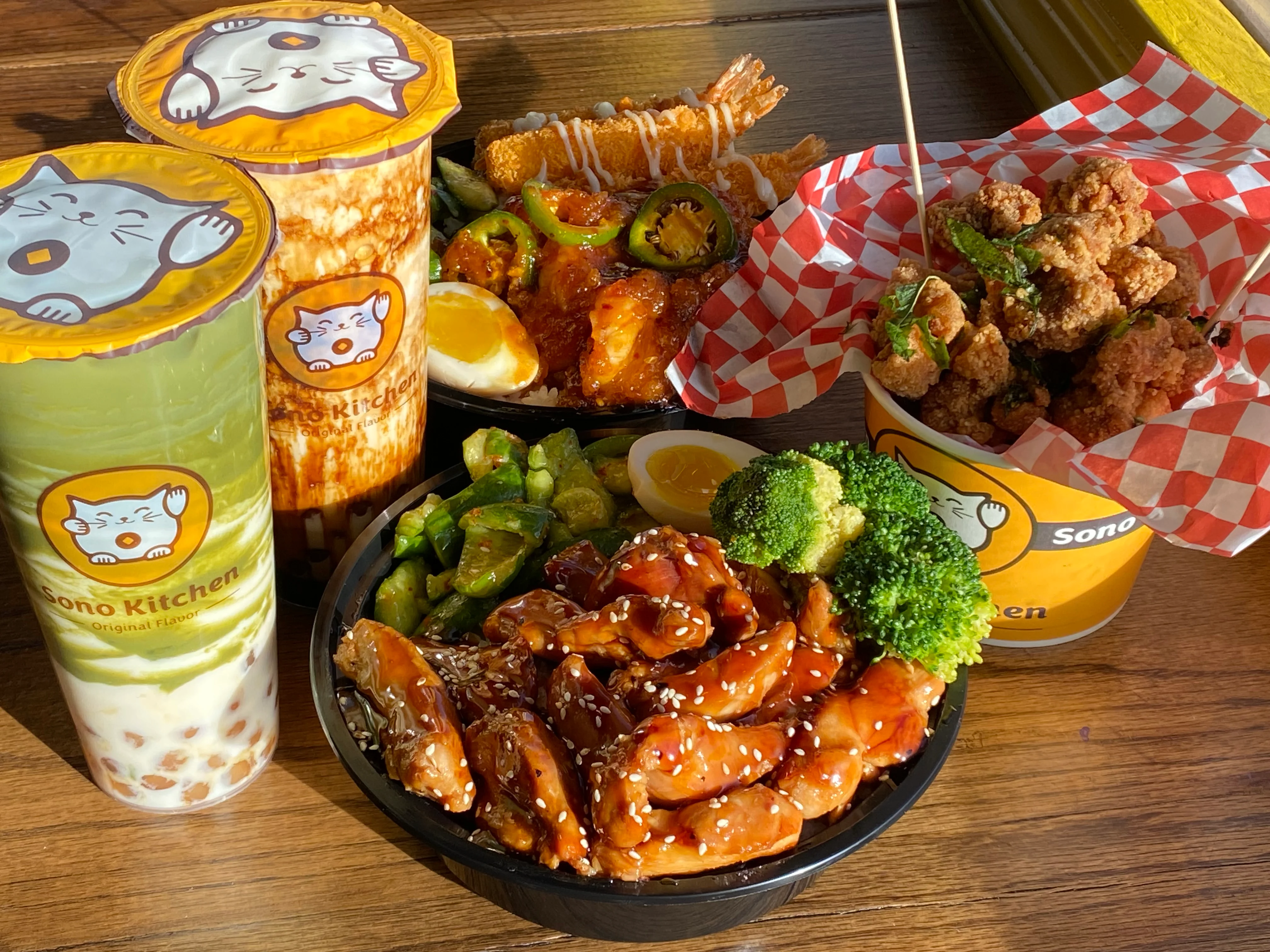 Assorted Asian dishes including chicken teriyaki and bubble tea