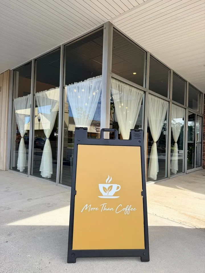 Charming café entrance with a welcoming sign