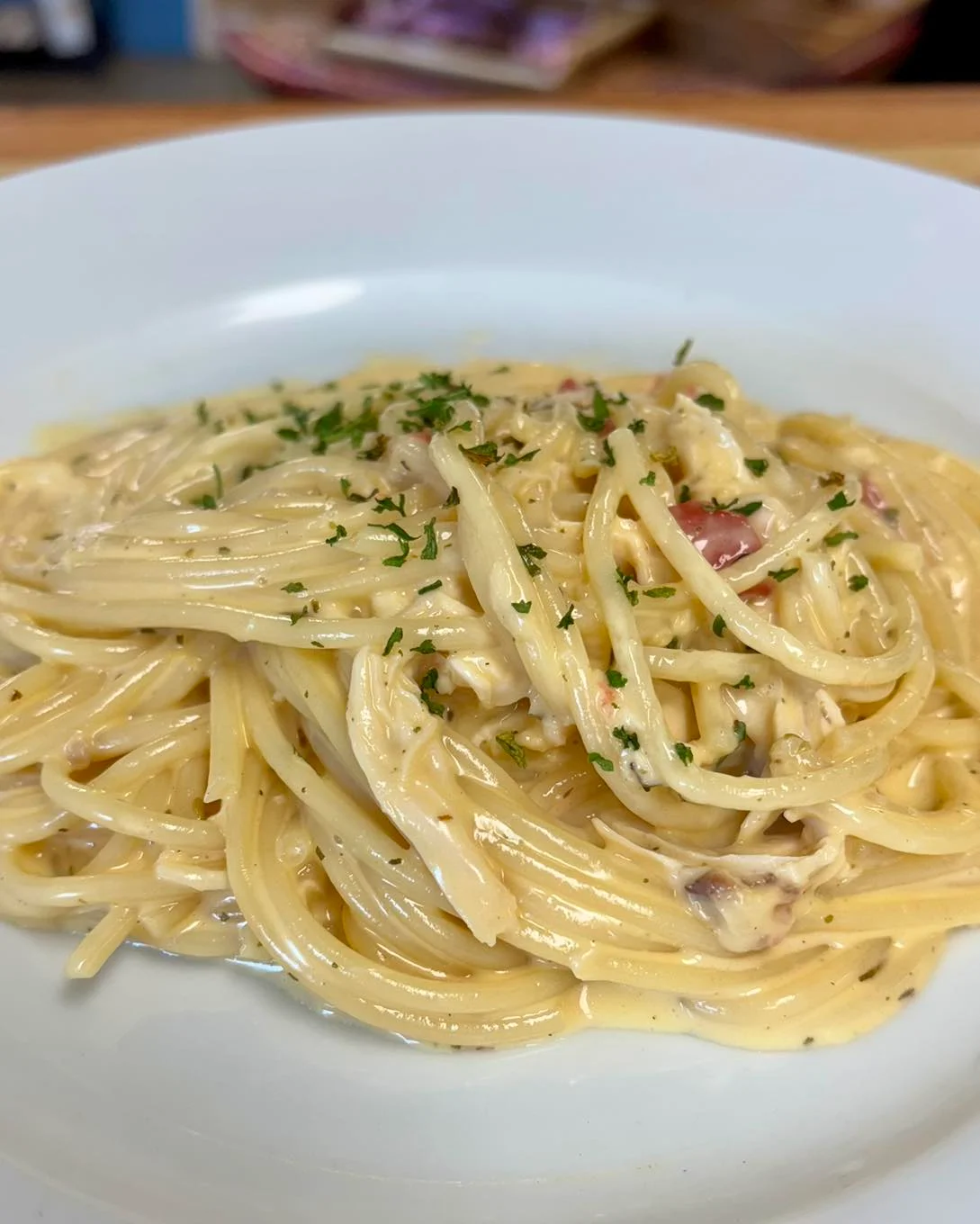 Creamy Italian carbonara pasta garnished with parsley