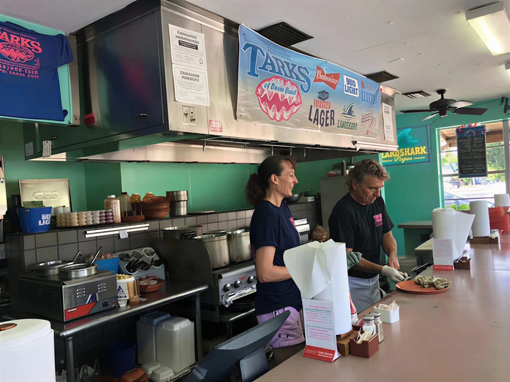 Friendly staff preparing an order at Tarks of Dania Beach
