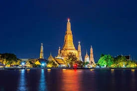 Wat Arun temple illuminated at night in Bangkok