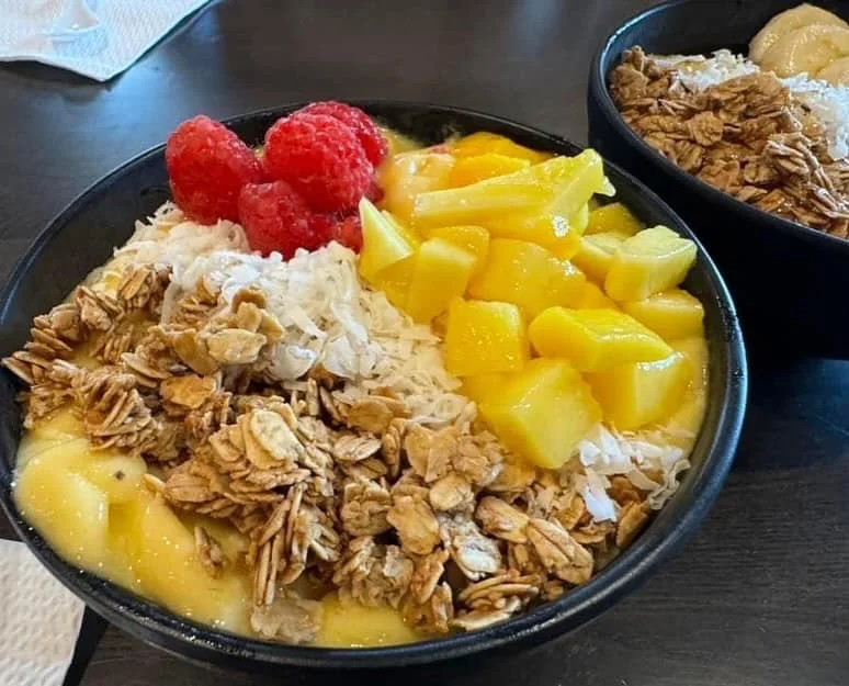 Tropical smoothie bowl with fresh fruits and granola
